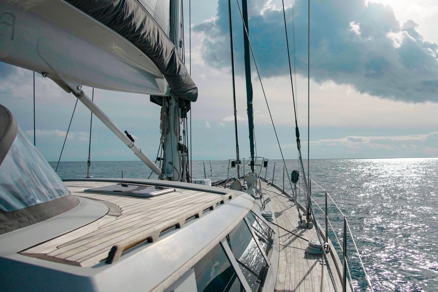 Baltic 73 Pilothouse yacht sailing on open sea under cloudy sky, 1999 model.