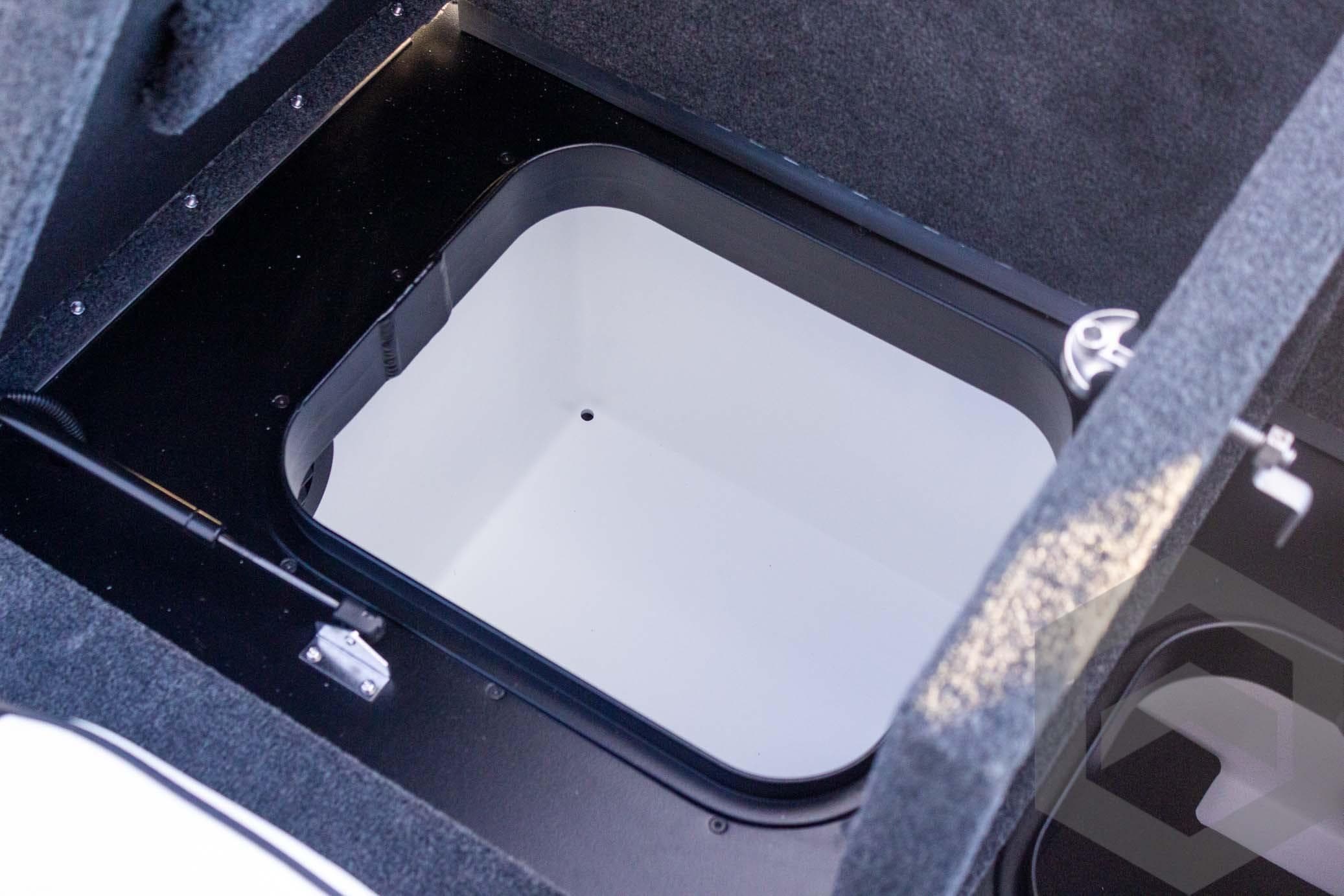 2026 Skeeter FXR21 FLEX boat storage compartment with open hatch, showcasing interior design.