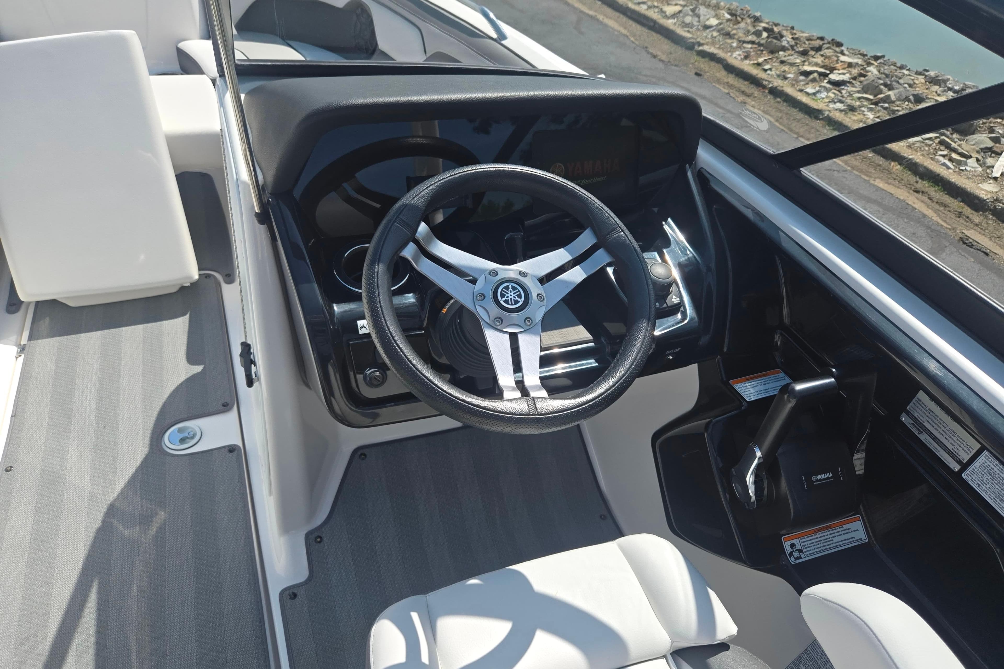 2019 Yamaha Boats 212 Limited S steering wheel and dashboard interior view.