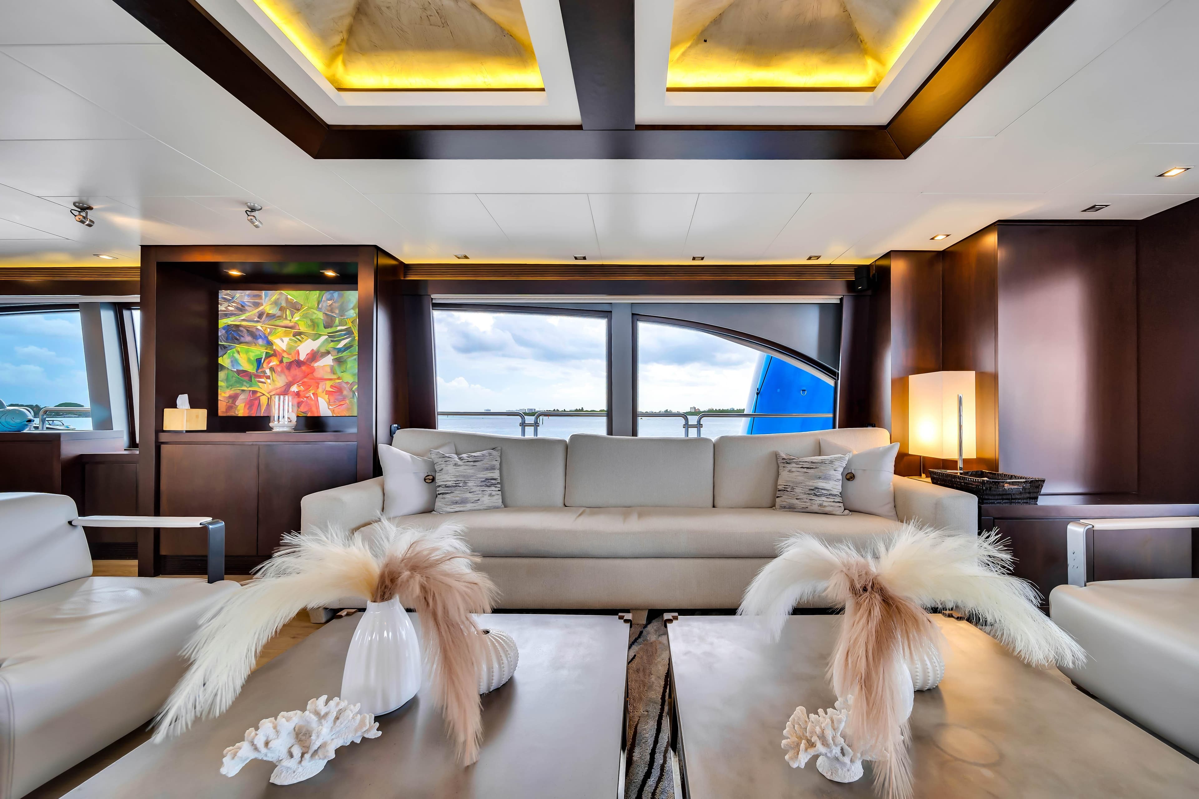 Luxurious 2012 Azimut yacht interior with elegant decor and panoramic windows.