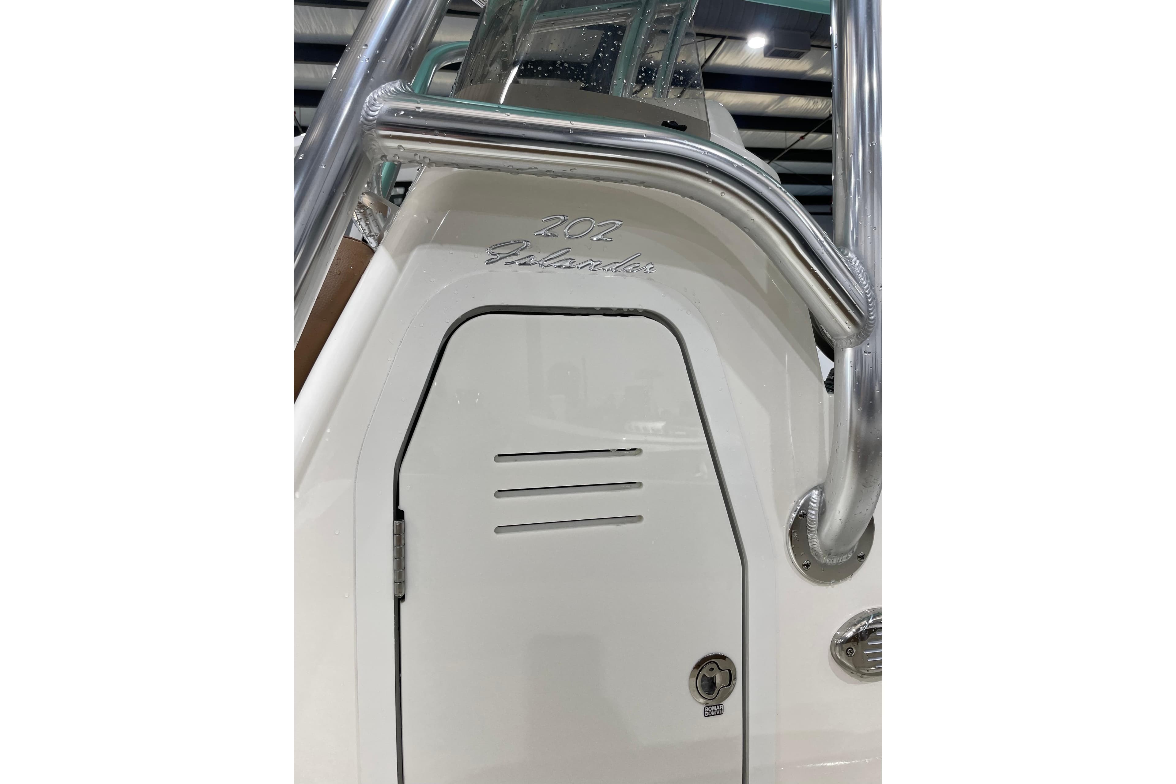 2026 Pioneer 202 Islander boat detail with sleek design and stainless steel railing.