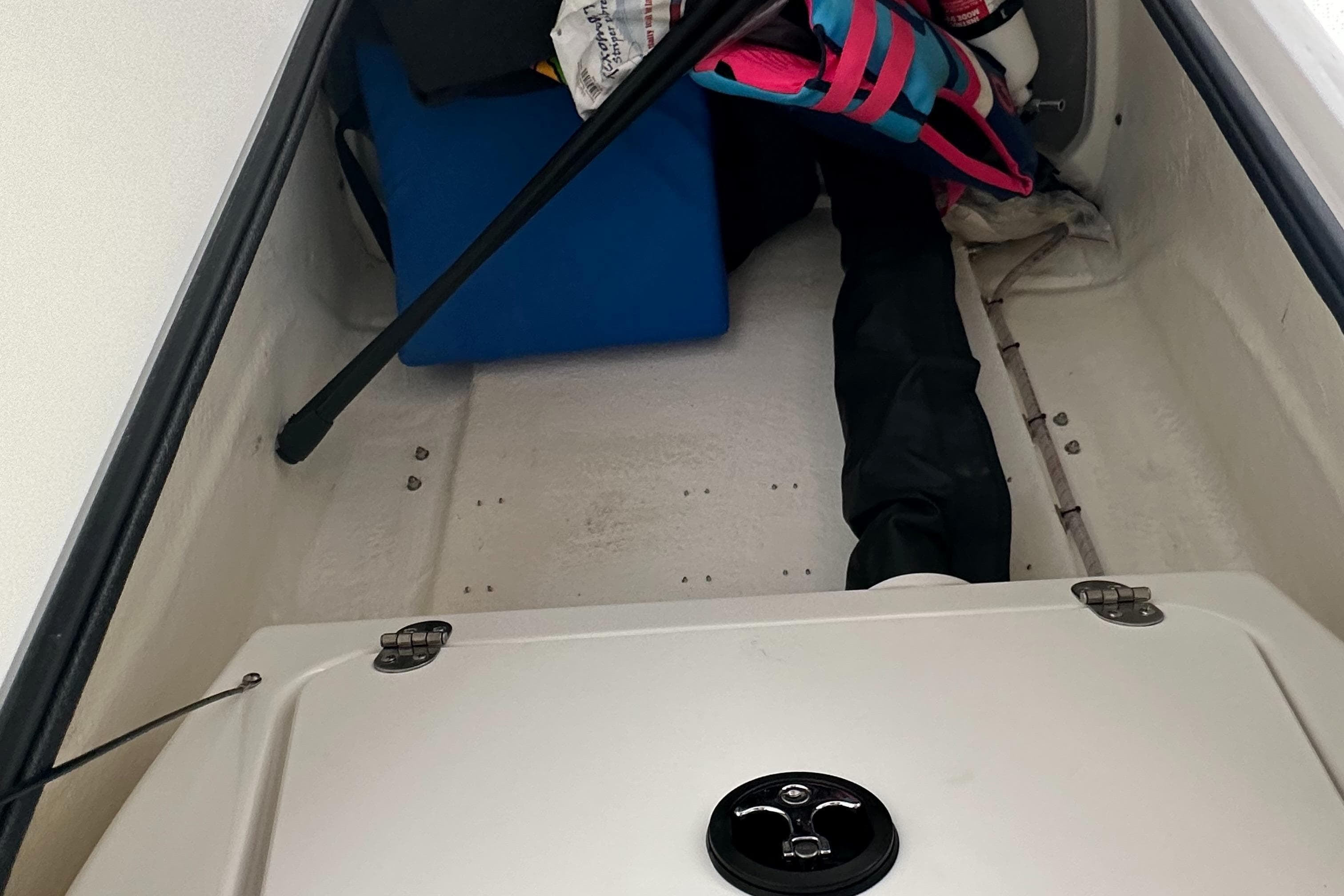 2022 Tahoe 2150 CC storage compartment with boating gear.