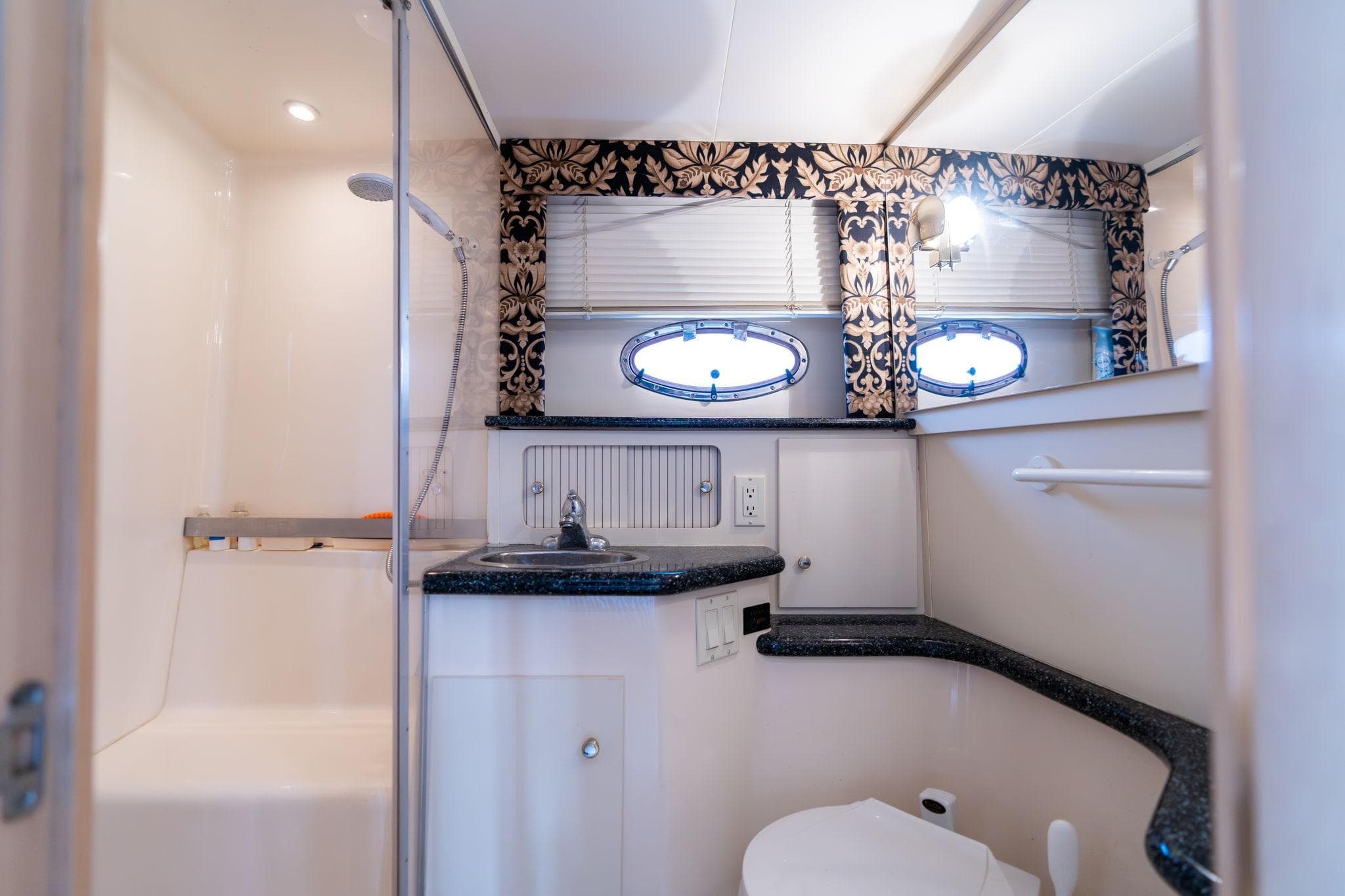 Luxurious bathroom in 2000 Carver 404 Cockpit Motor Yacht with elegant decor.