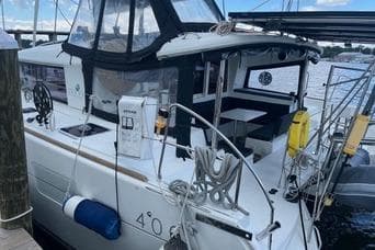 2018 Lagoon 400 S2 catamaran docked, featuring spacious deck and modern design.