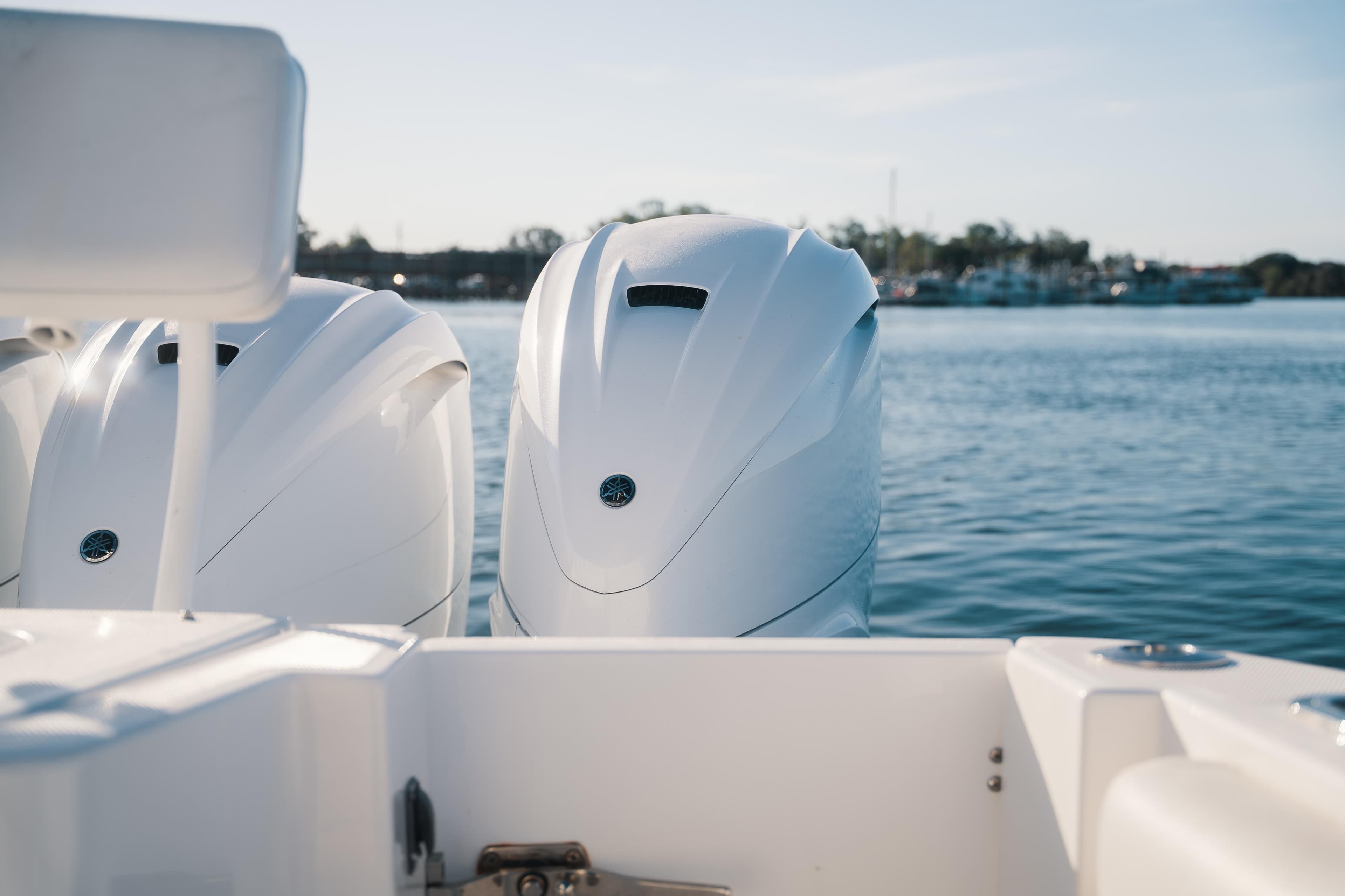 2019 HCB 42 Siesta boat engines on calm water background.