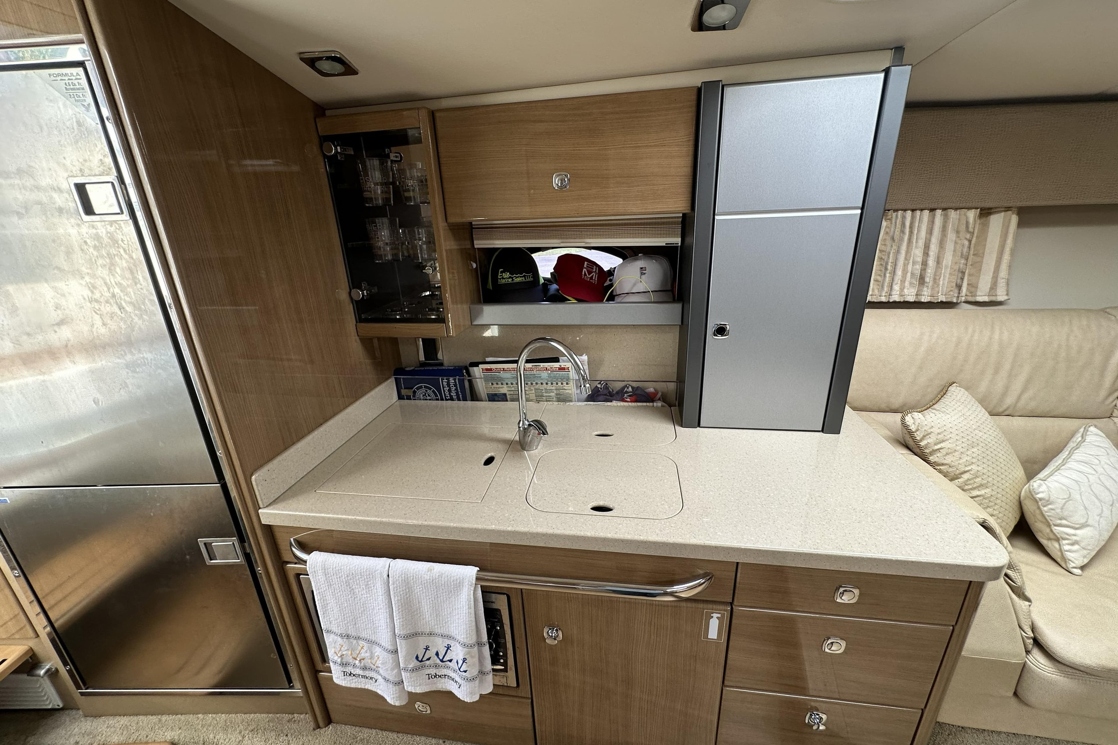 Interior of 2011 Formula Yachts 40ss featuring modern kitchenette with sink and storage.