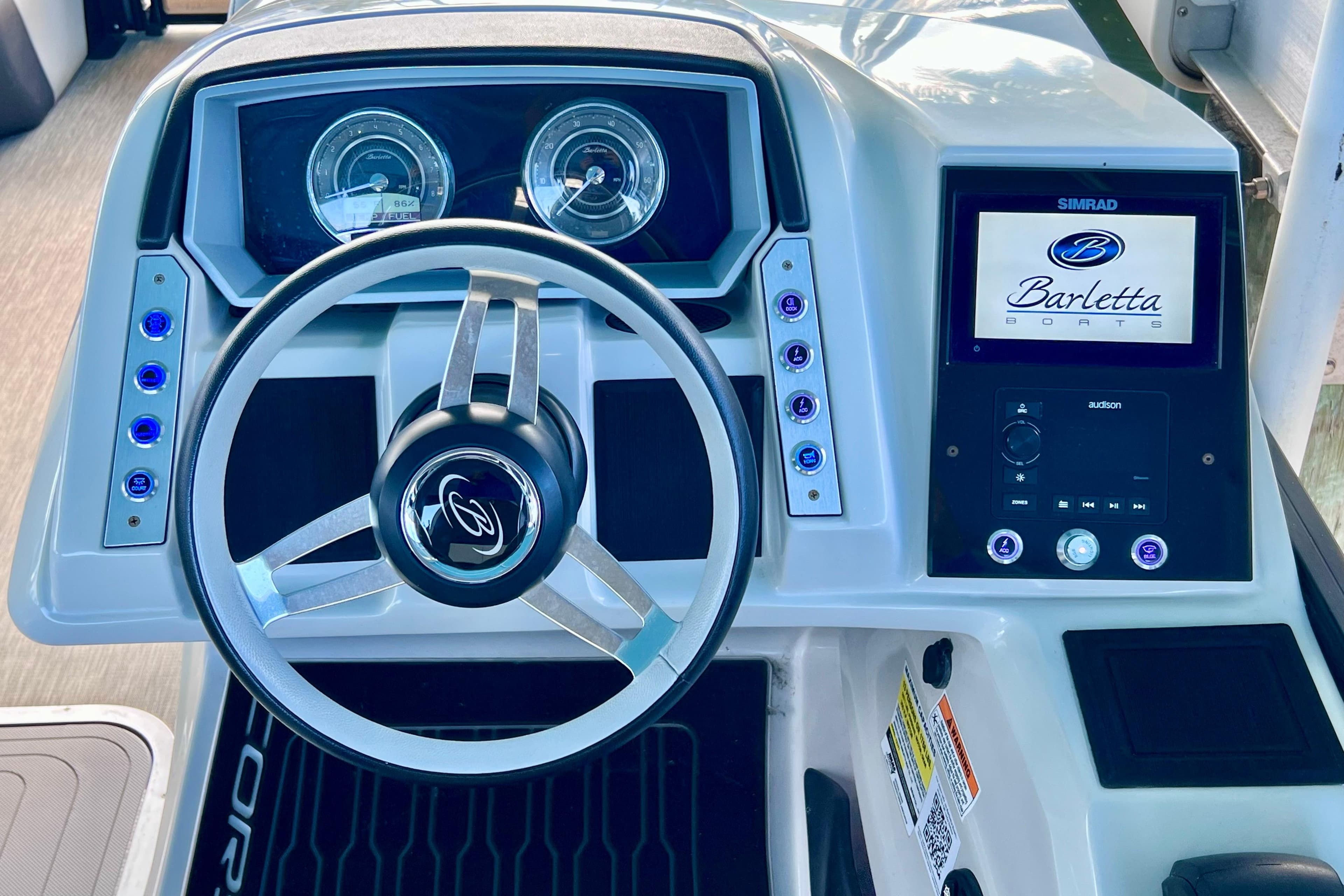 2023 Barletta Corsa 23UC dashboard with steering wheel and digital display.