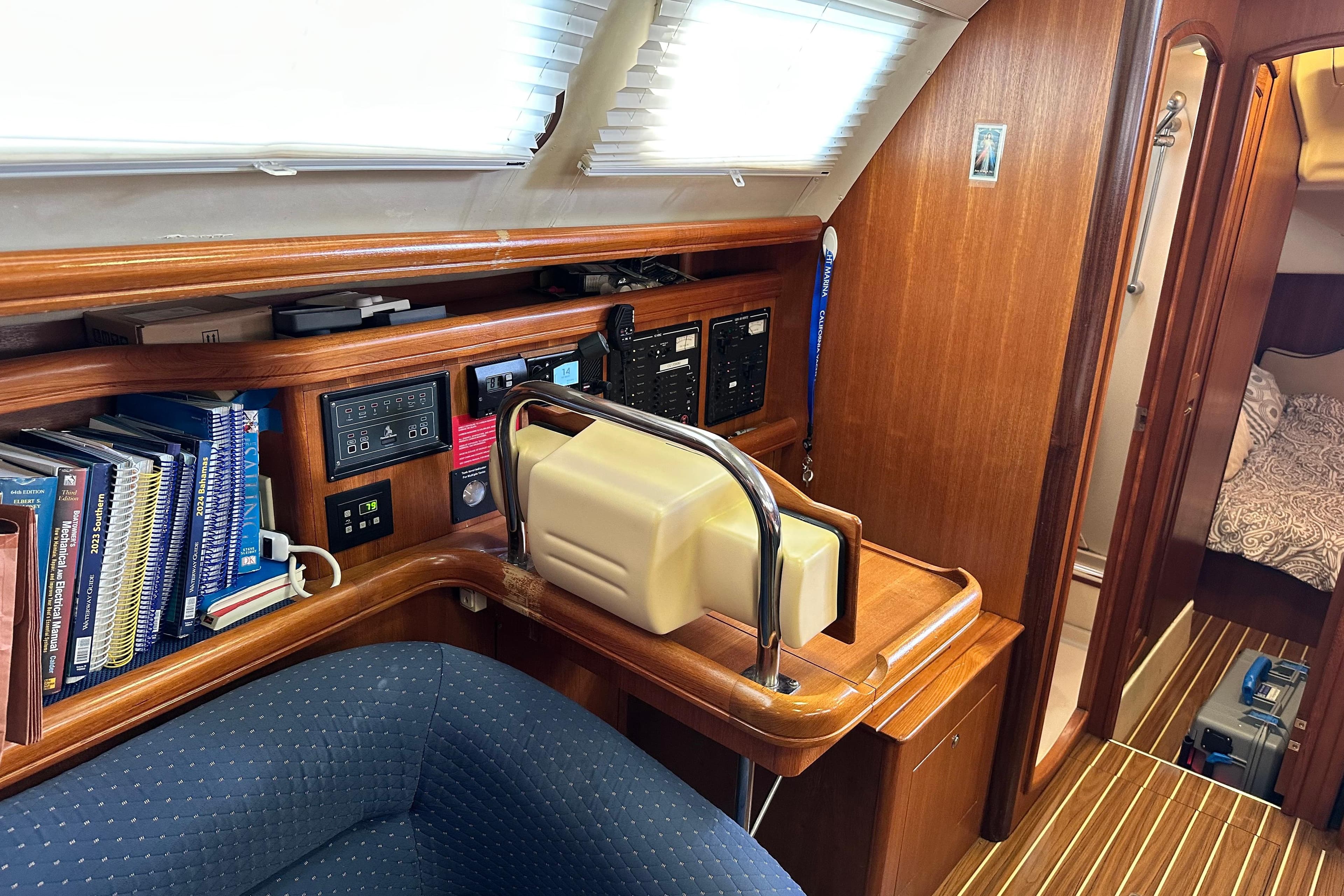 2006 Hunter 41 Deck Salon interior with navigation station and cozy cabin view.