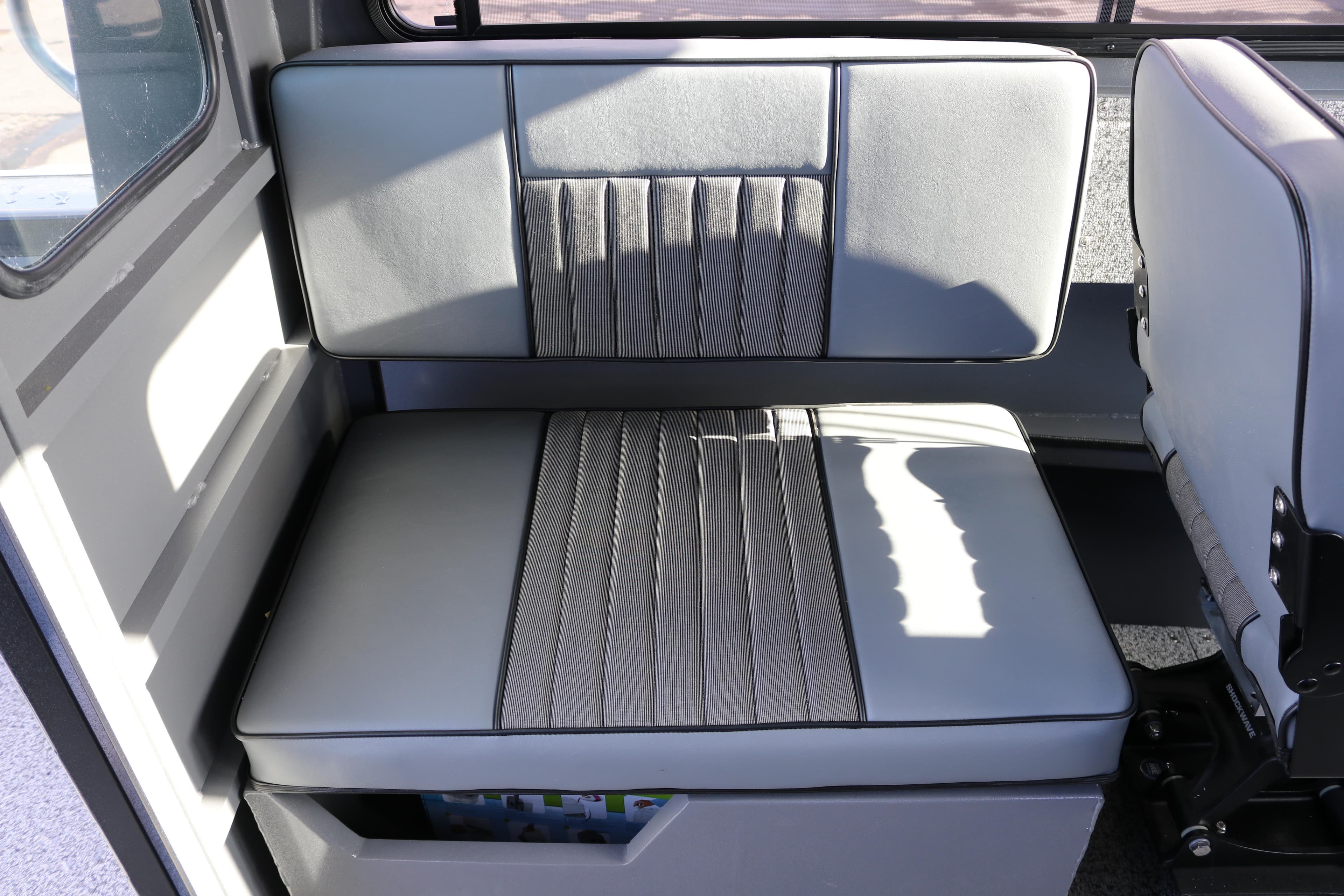 2026 Alumaweld Intruder Hard Top 24 interior seating with gray upholstery.