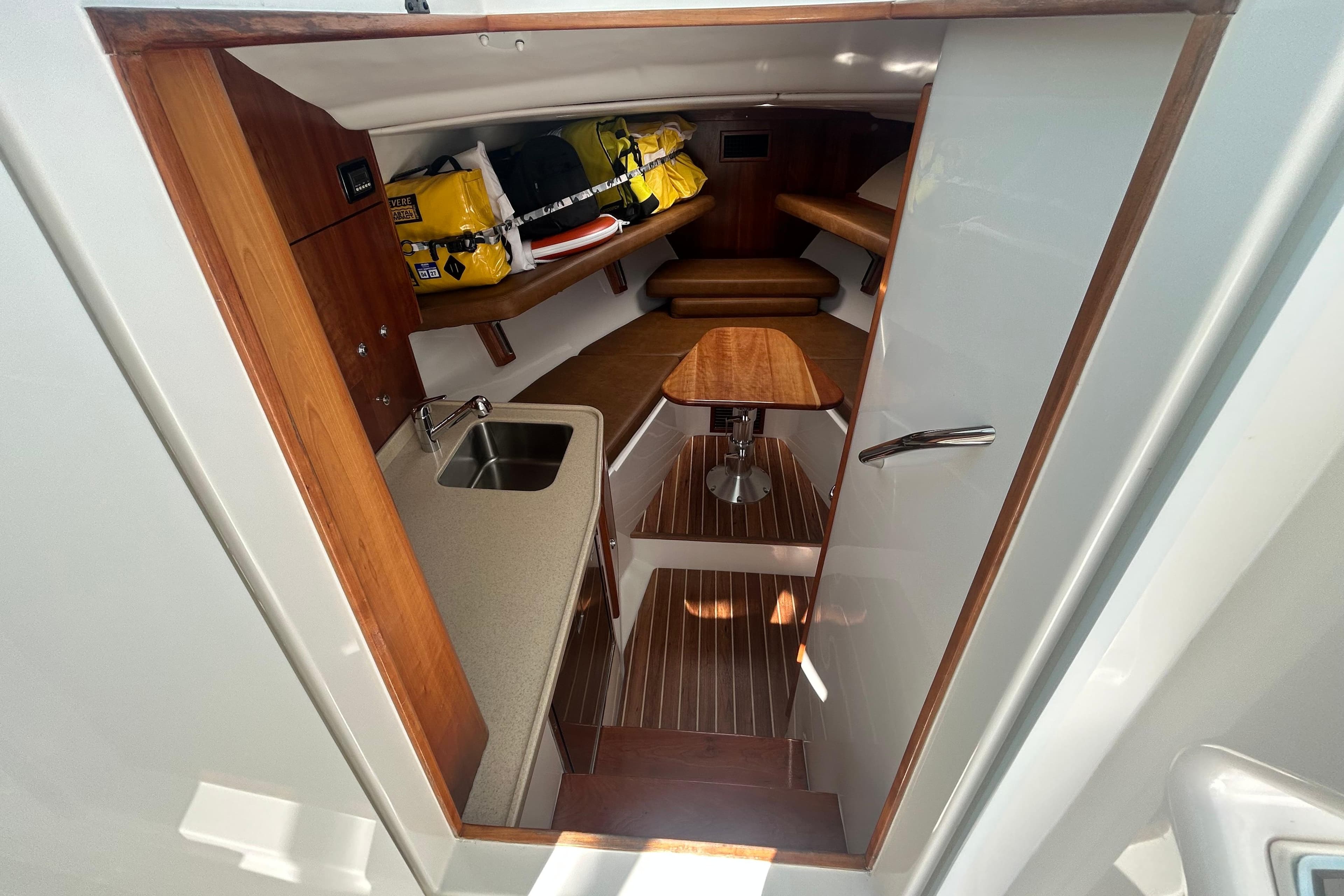 Interior of 2018 Albemarle 29 Express boat with kitchenette and seating area.