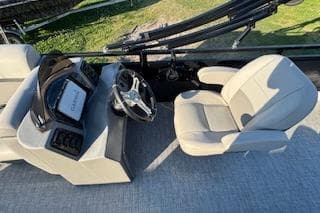 2023 Angler Quest 8522 All Sport boat interior with steering console and seating.