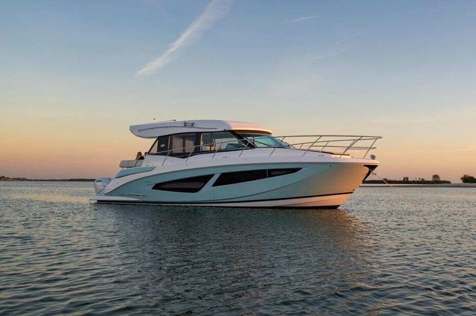 Manufacturer Provided Image: 2026 Regal 42 XO yacht on calm water at sunset.