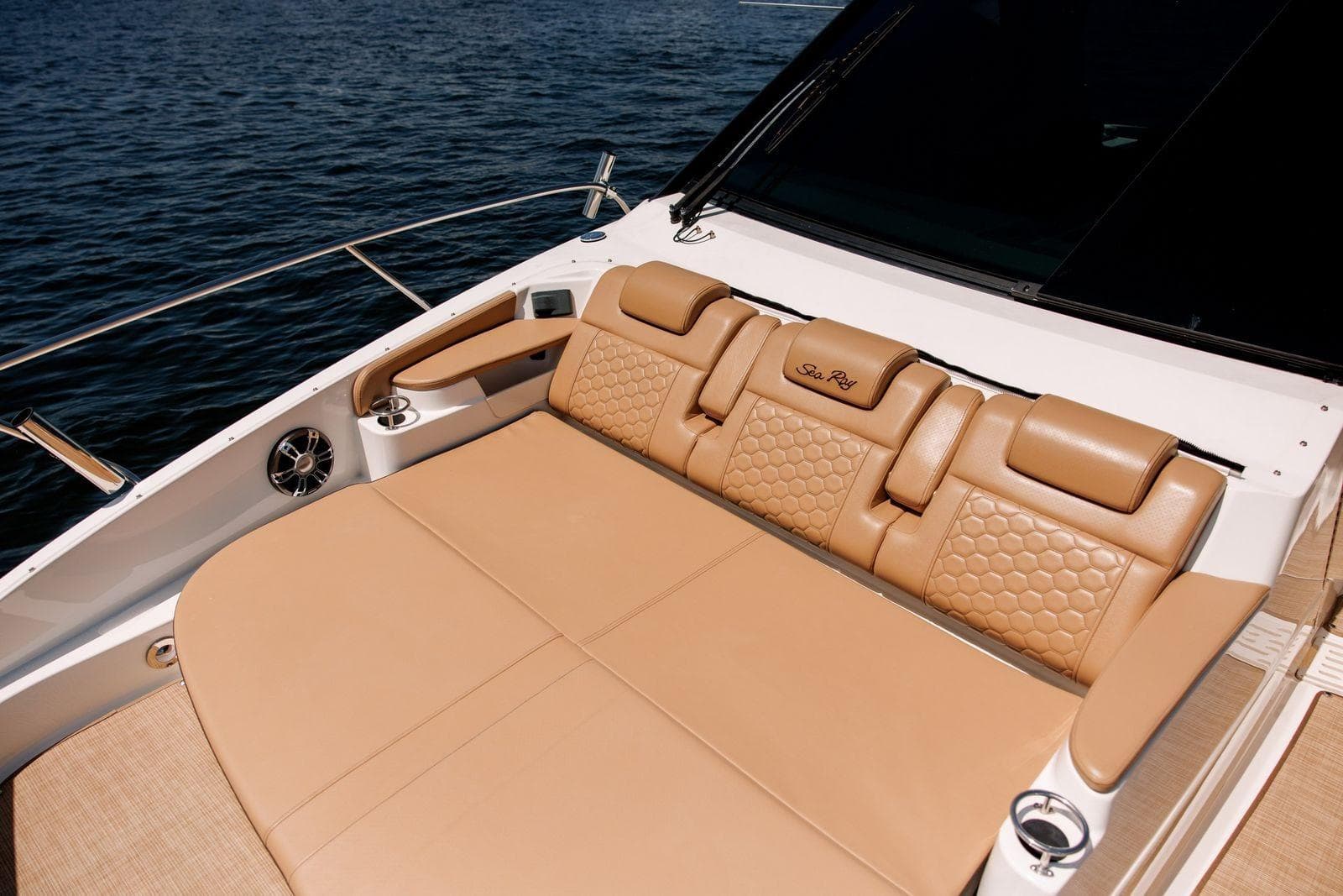 Luxurious seating on 2022 Sea Ray Sundancer 320 Outboard, featuring tan leather upholstery.