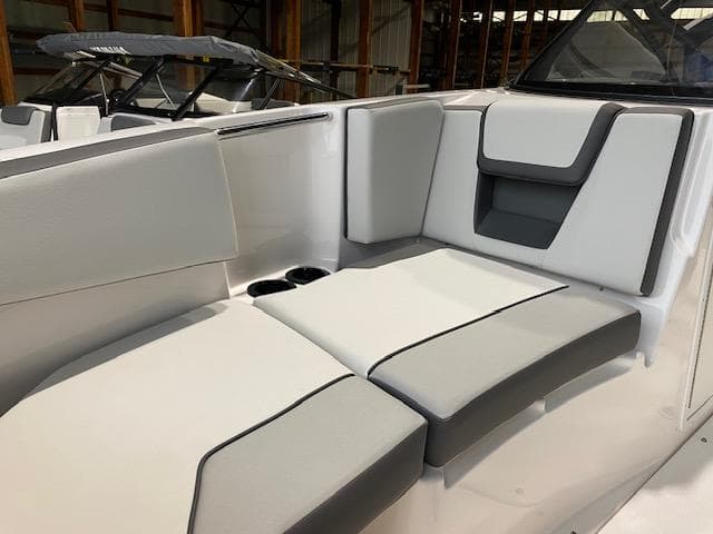 2025 Yamaha Boats AR220 interior with sleek, modern seating and cup holders.