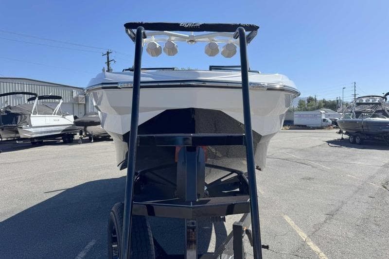 2026 Tigé Z3 boat on trailer in outdoor lot, front view.