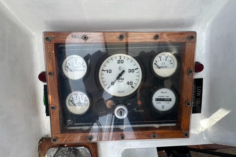 Instrument panel of a 1968 Camper & Nicholsons 38 Ketch, featuring gauges and dials.