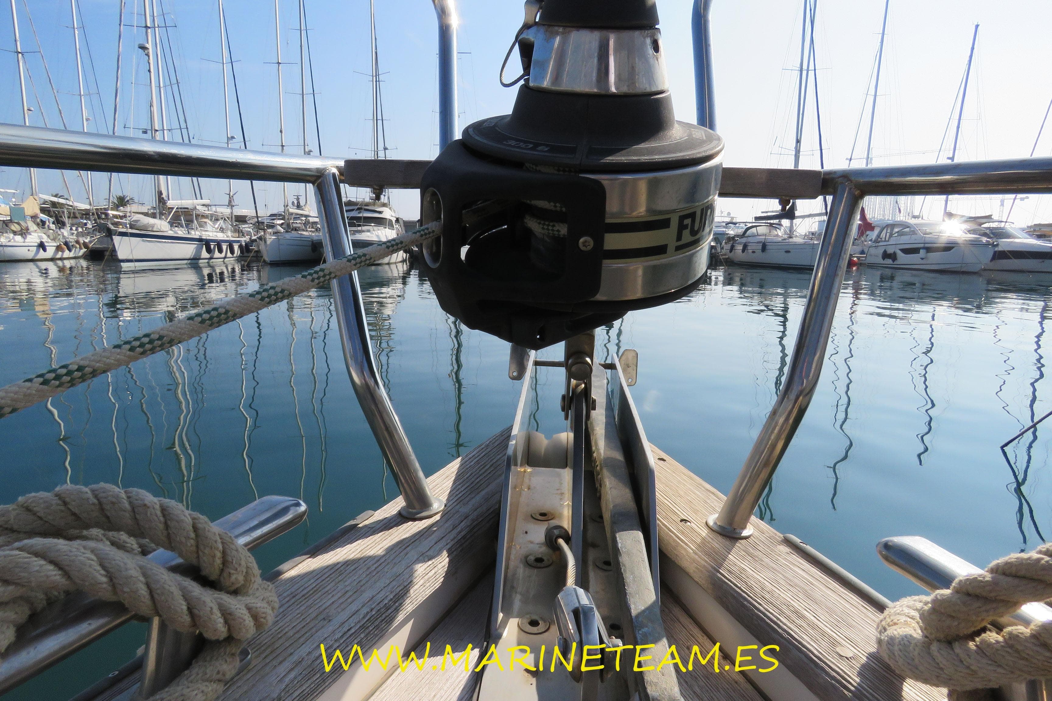 Bow view of a 2002 Najad 373 sailboat docked in a marina.