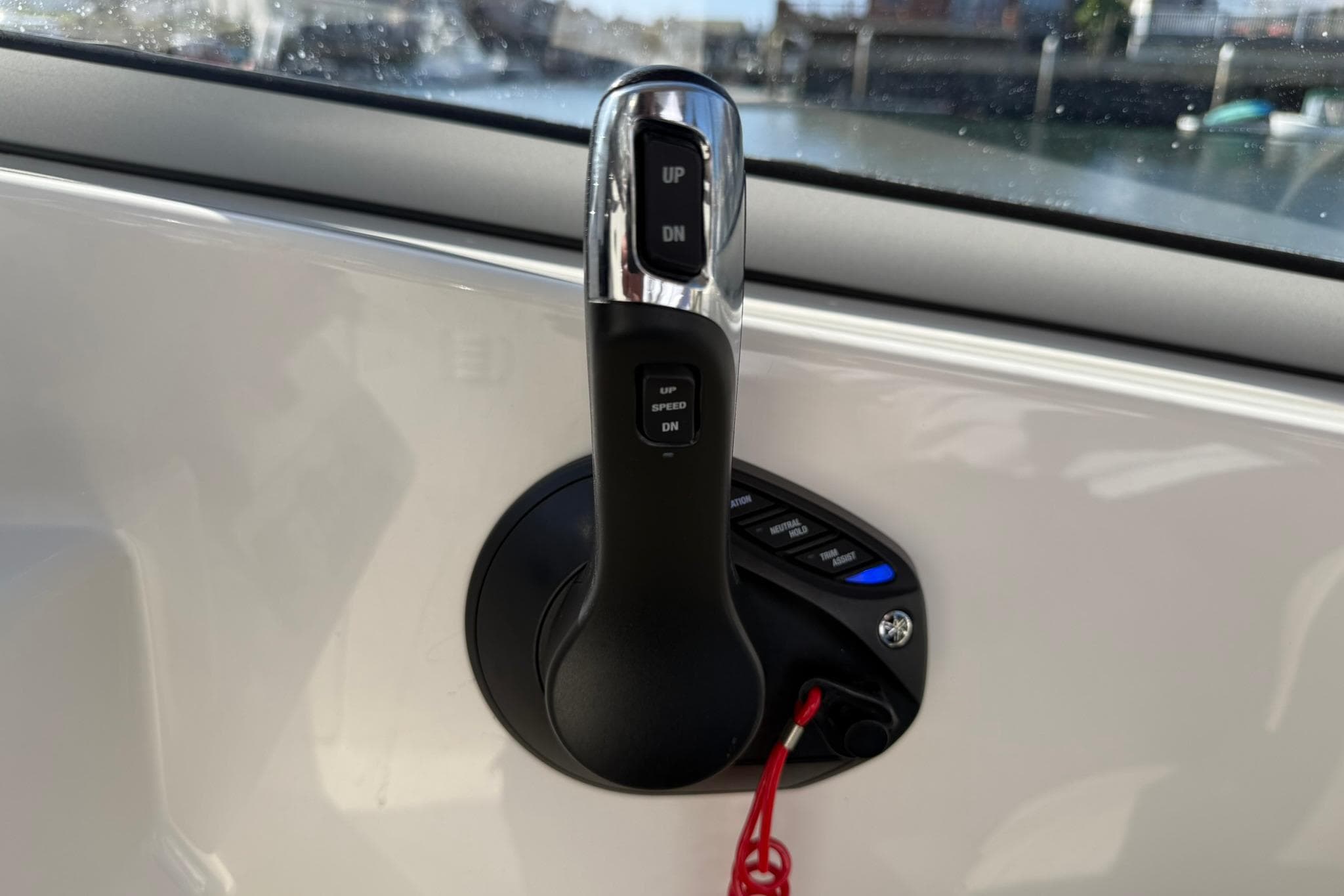 Throttle control of 2023 Key West 239 DFS boat, featuring speed and direction buttons.