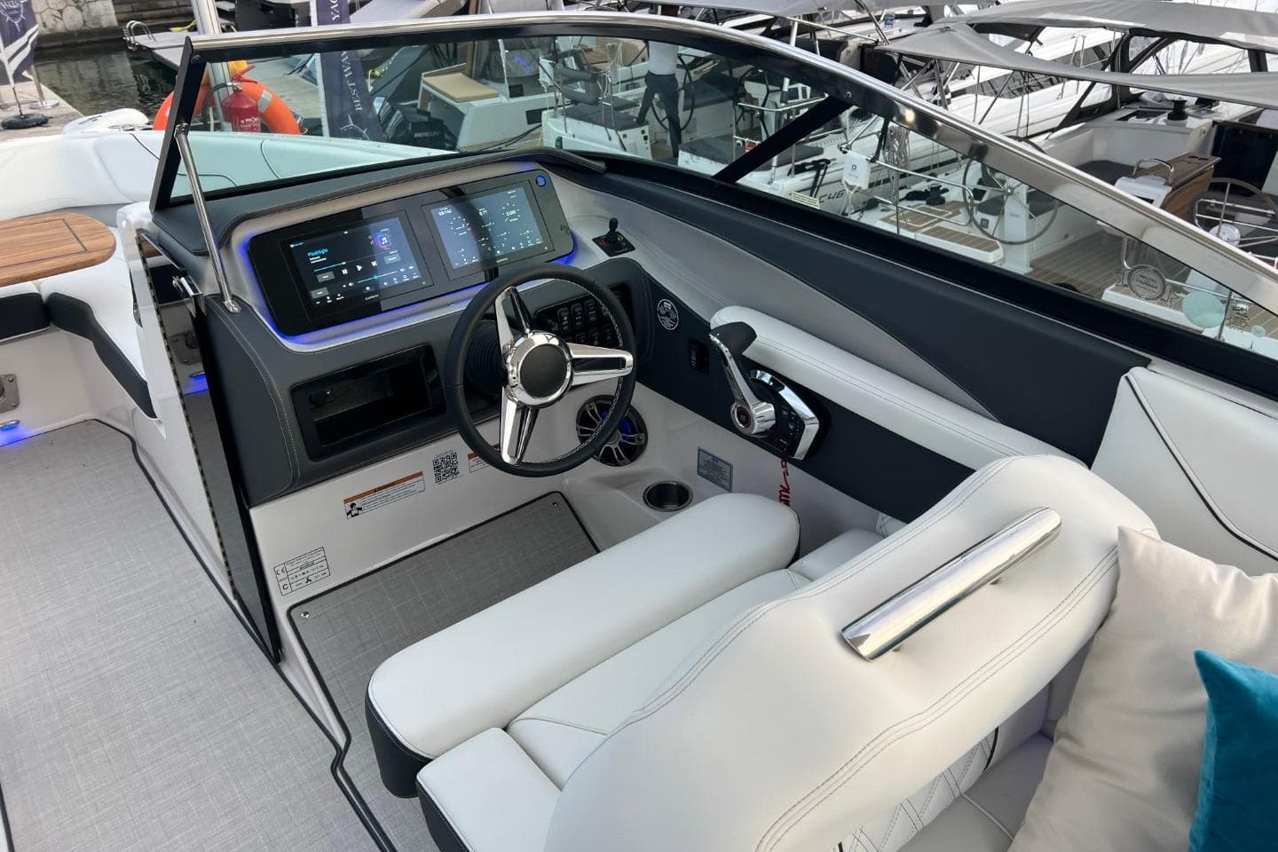 2025 Regal LS6 boat cockpit with modern steering and dual digital displays.
