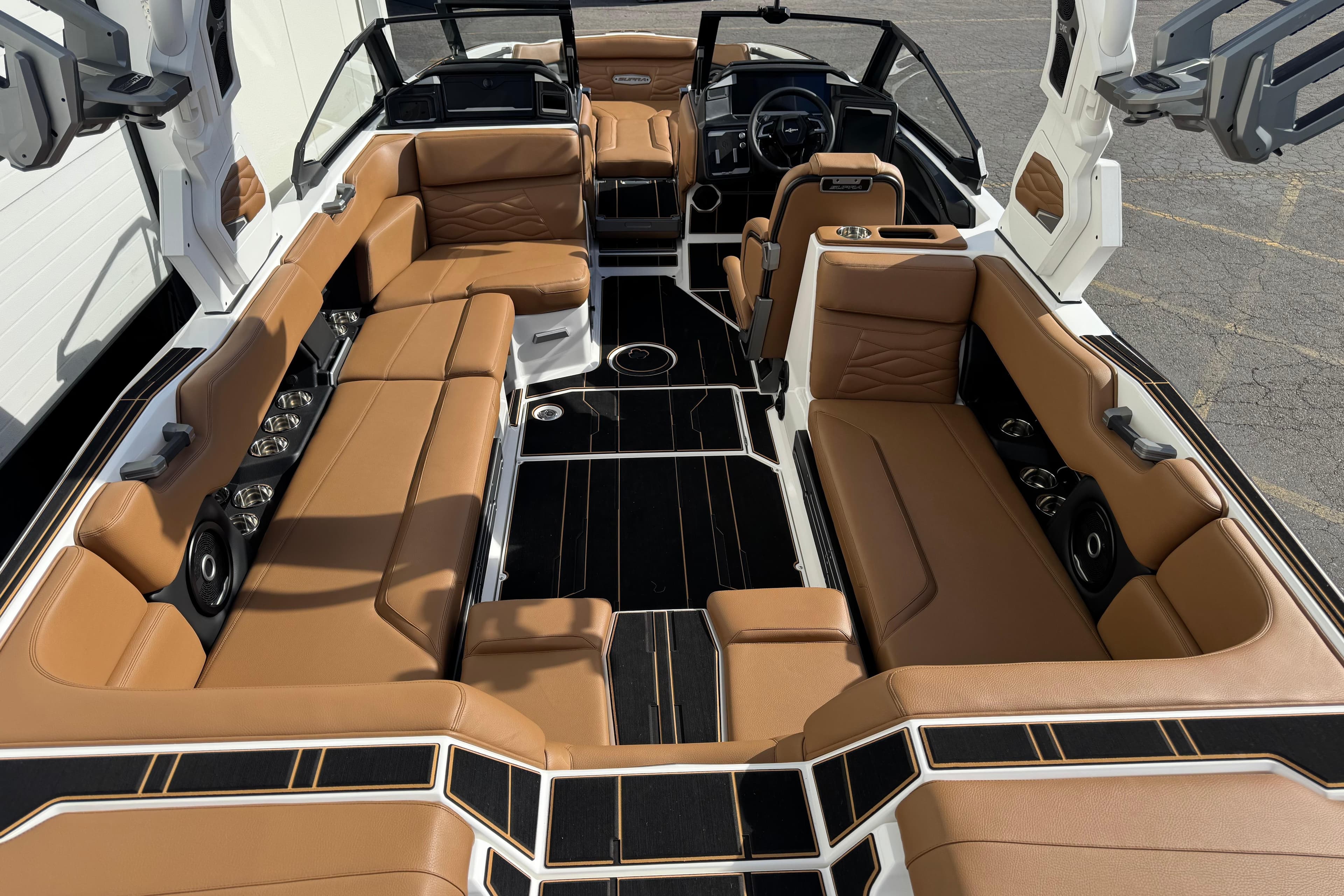 2026 Supra SL 575 boat interior with luxurious tan leather seating and modern design.