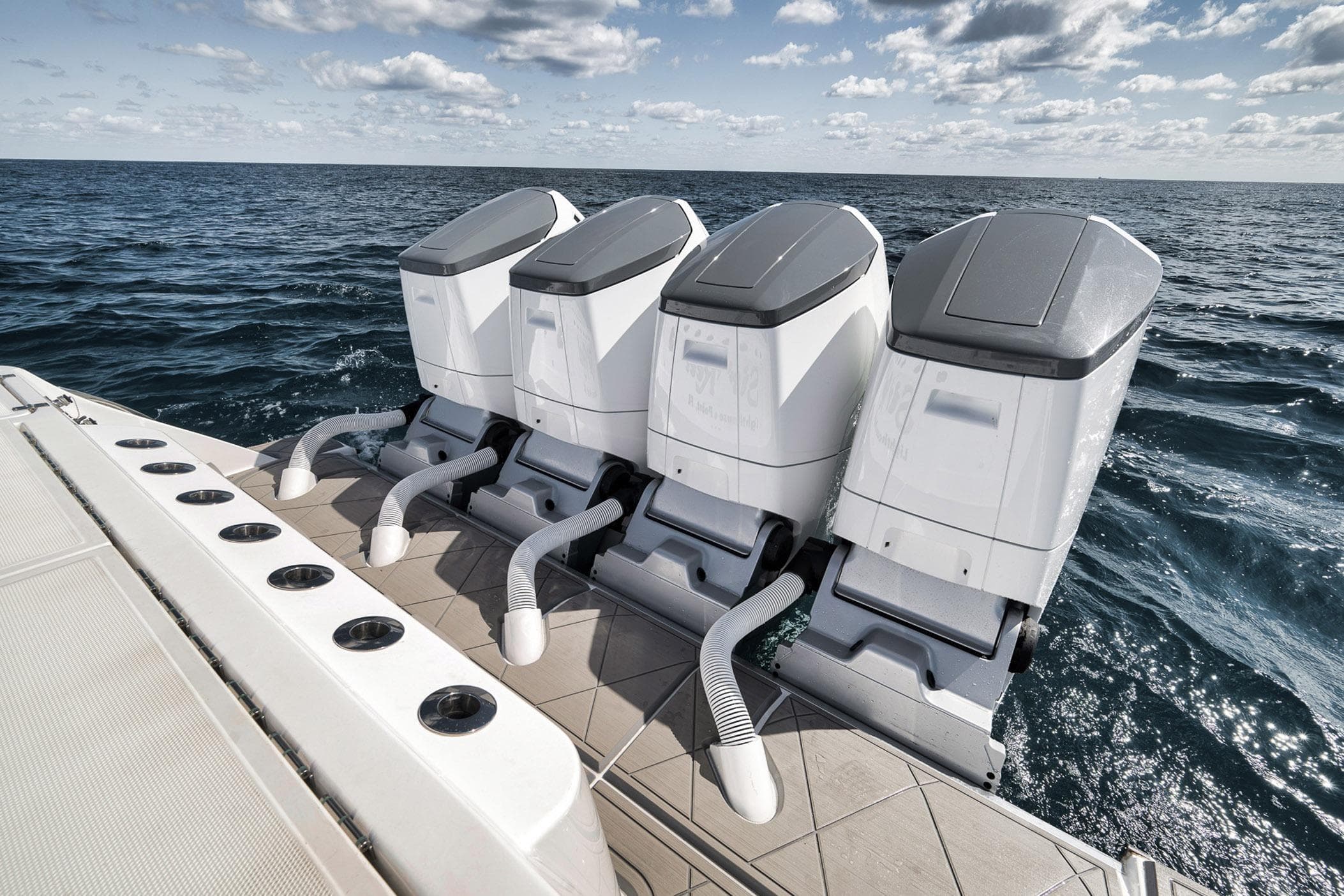 2025 HCB 53 Suenos boat with four powerful outboard engines on open sea.