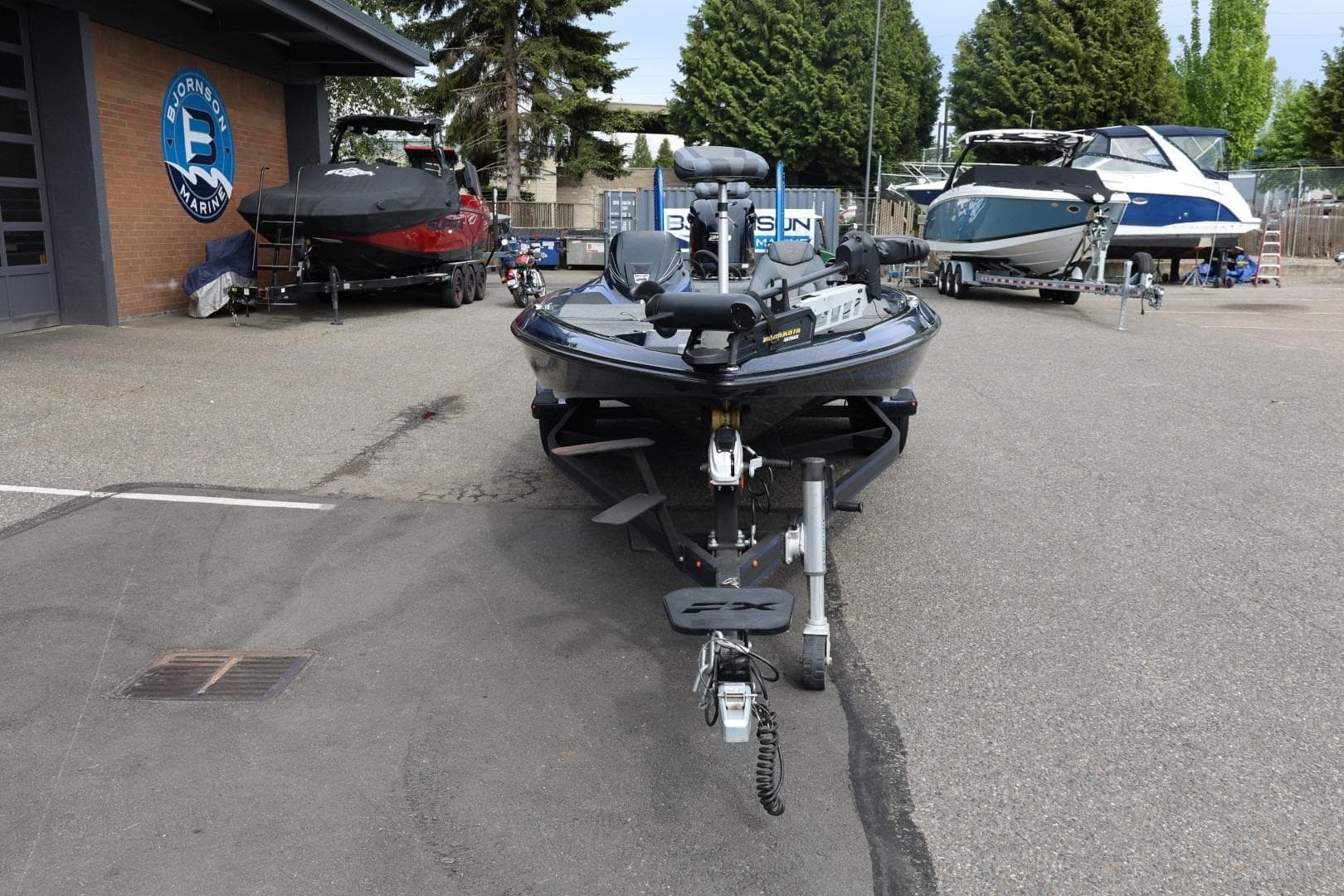 2018 Skeeter FX21 Limited Edition boat parked at a marina with other boats.