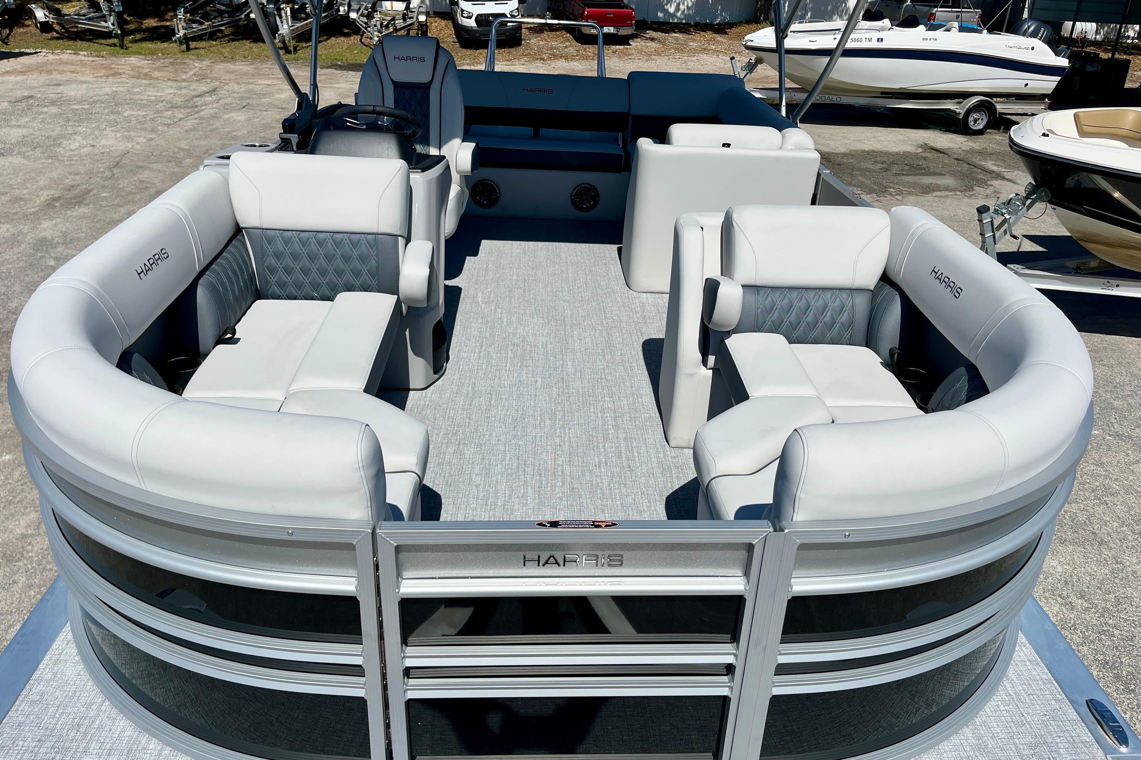 2025 Harris Sunliner 210 pontoon boat with luxurious seating area.