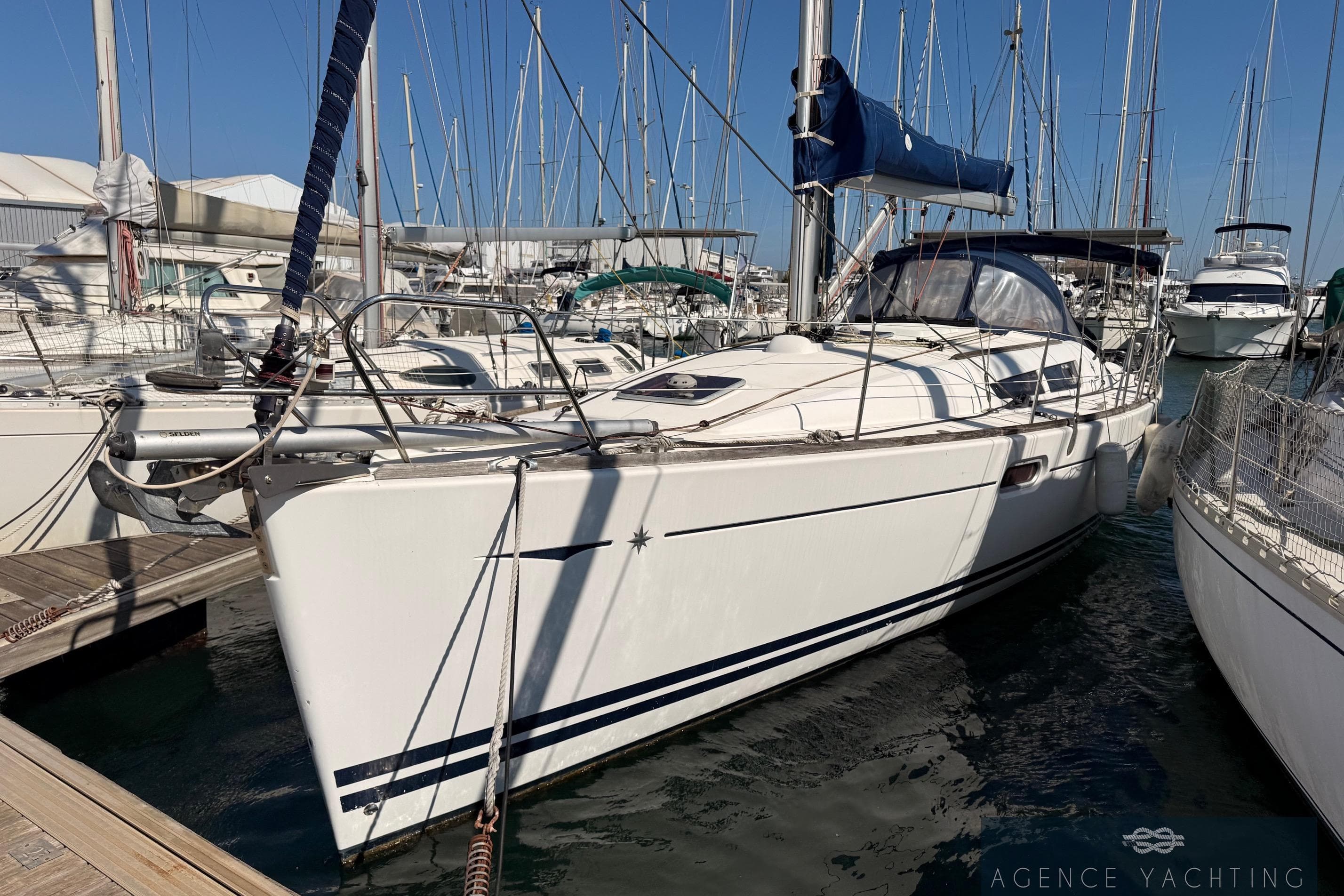 2009 Jeanneau Sun Odyssey 39i Performance sailboat docked in marina.