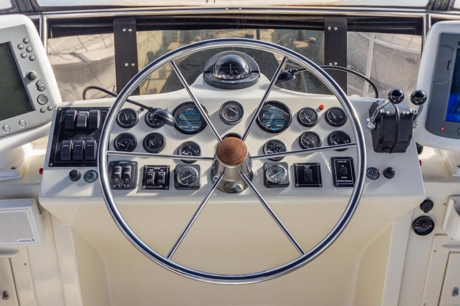 Helm of 1987 Californian 48 Convertible yacht with navigation instruments.