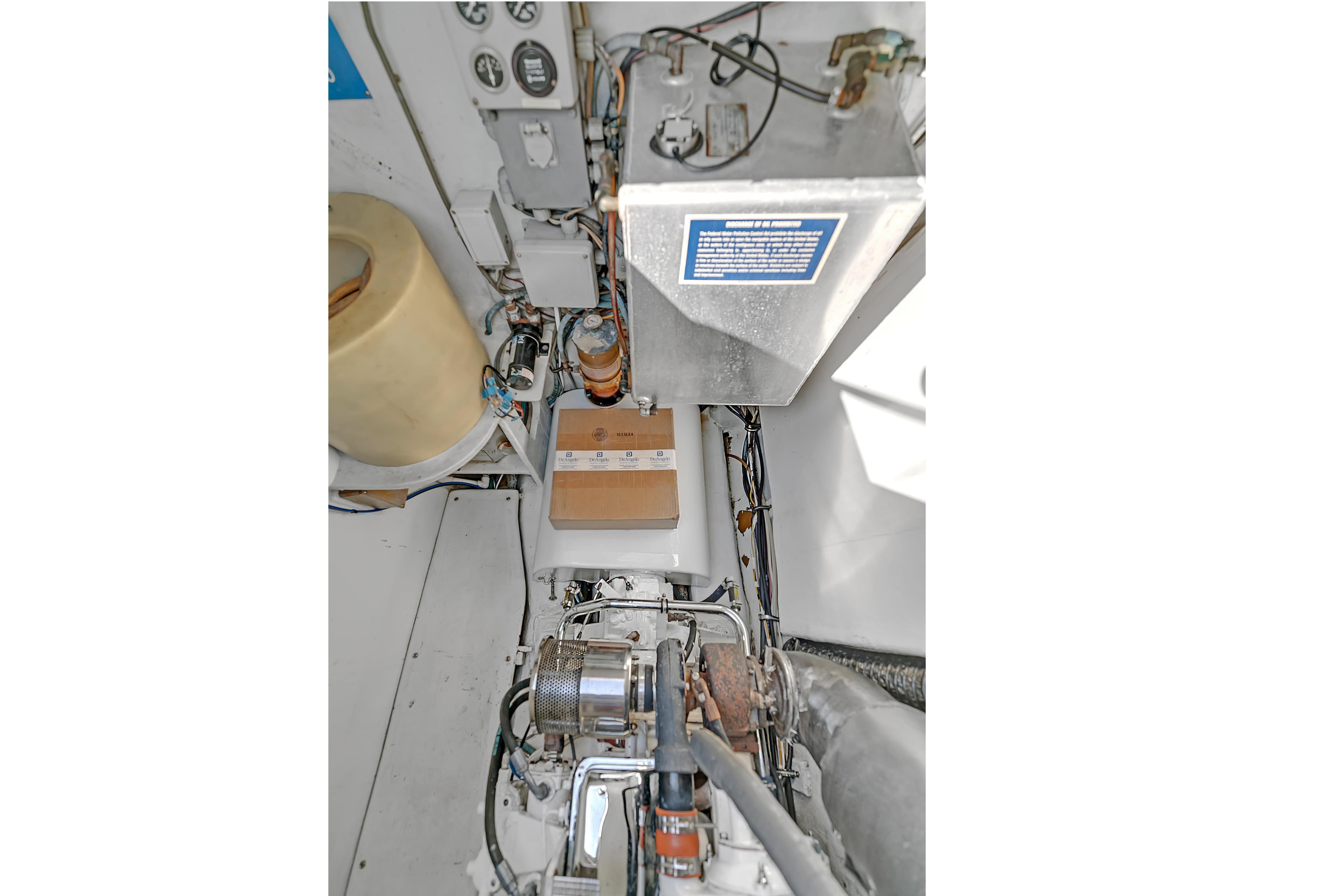 Engine room of 1988 Kelsall Manannan Custom boat, showcasing mechanical components and wiring.