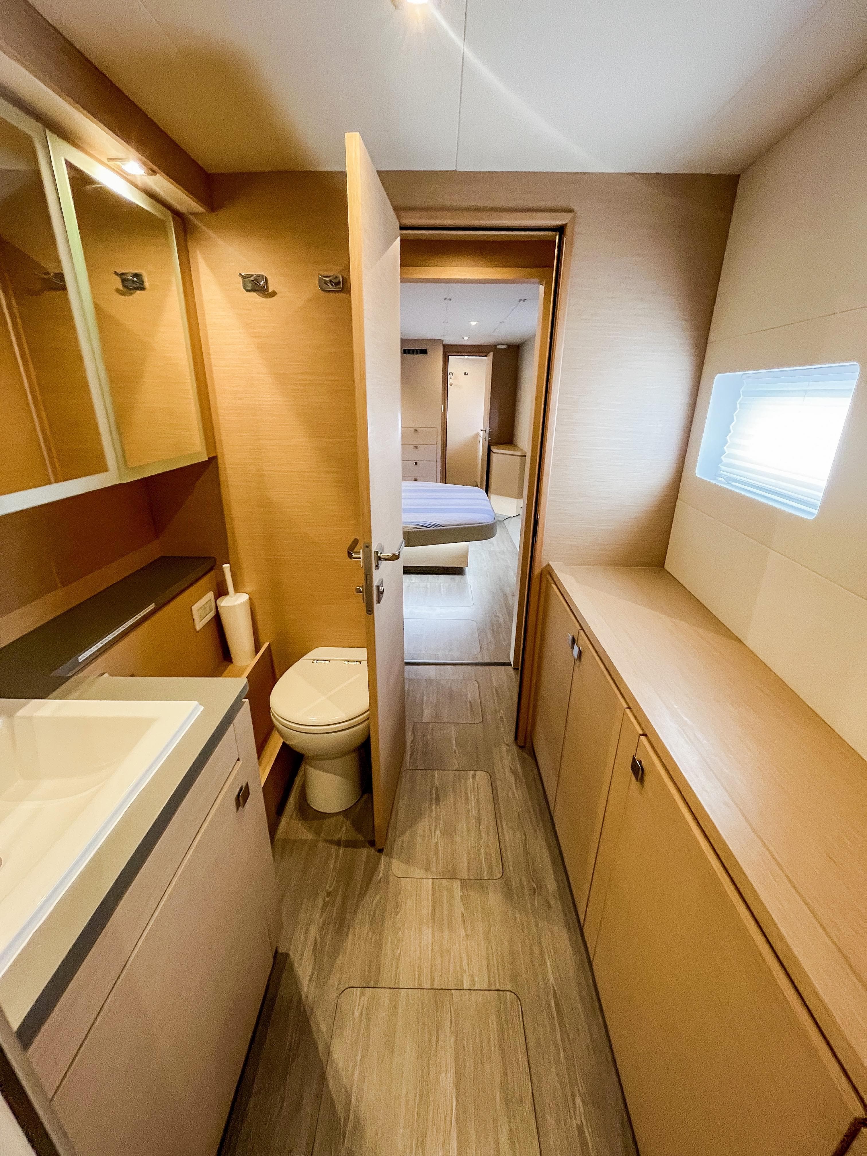 Luxurious bathroom interior of 2020 Fountaine Pajot MY 44 yacht, featuring modern fixtures and wood accents.