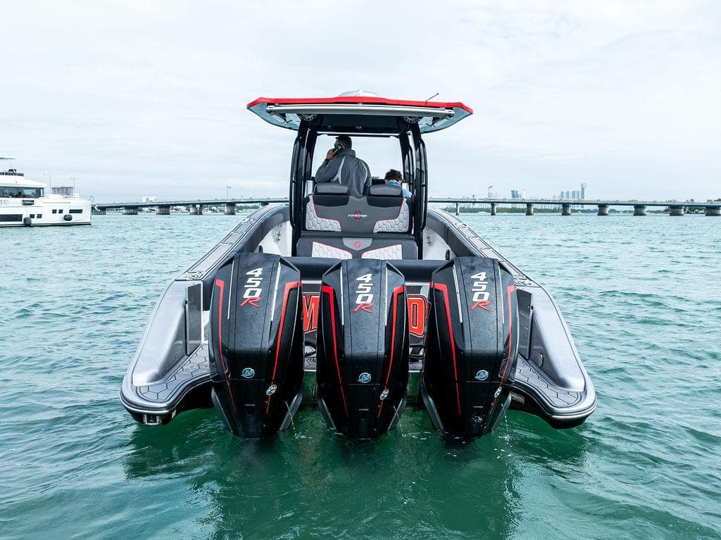 2021 Fountain 39 NX boat with four powerful outboard engines on the water.