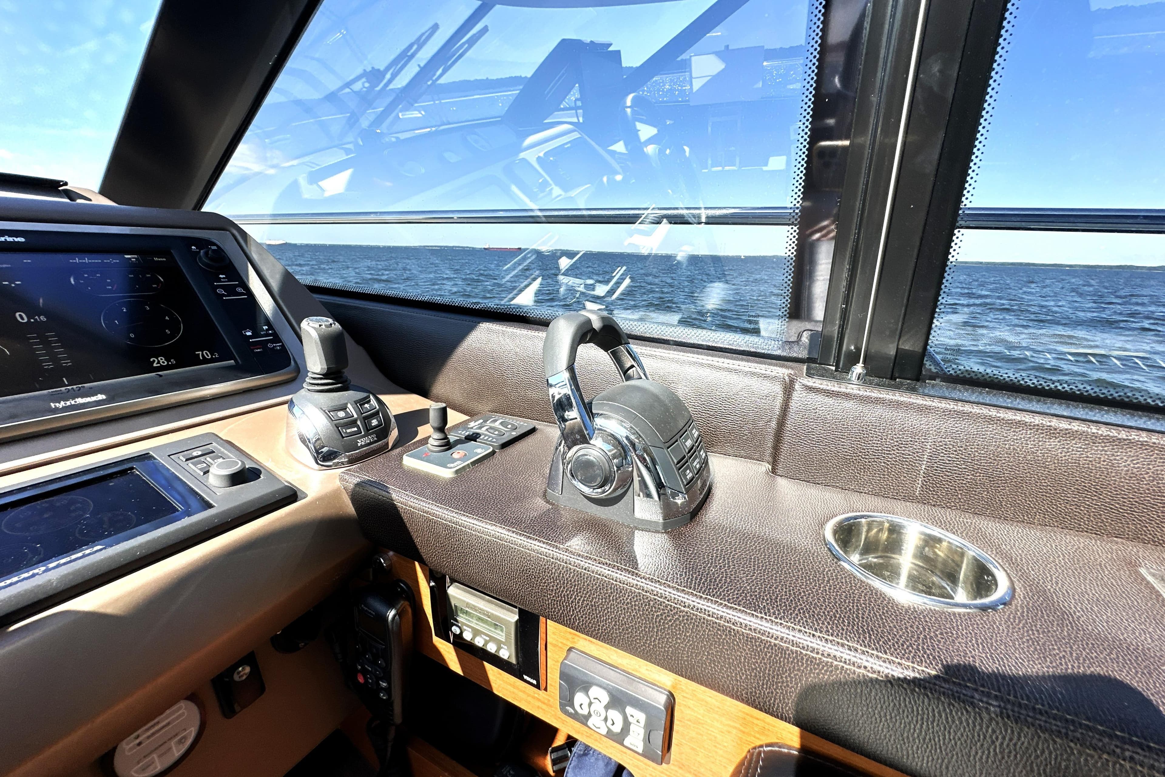Interior of 2016 Prestige 500S yacht cockpit with navigation controls and ocean view.