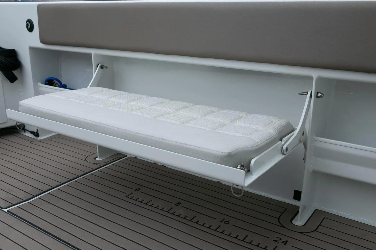 2026 Extreme Boats 986 Game King interior with foldable bench seat and teak flooring.