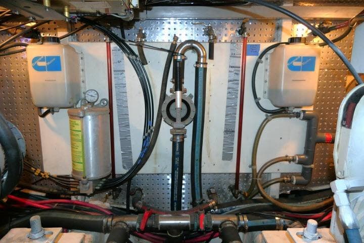Engine room of a 1999 Hampton 490 Pilothouse with various mechanical components.