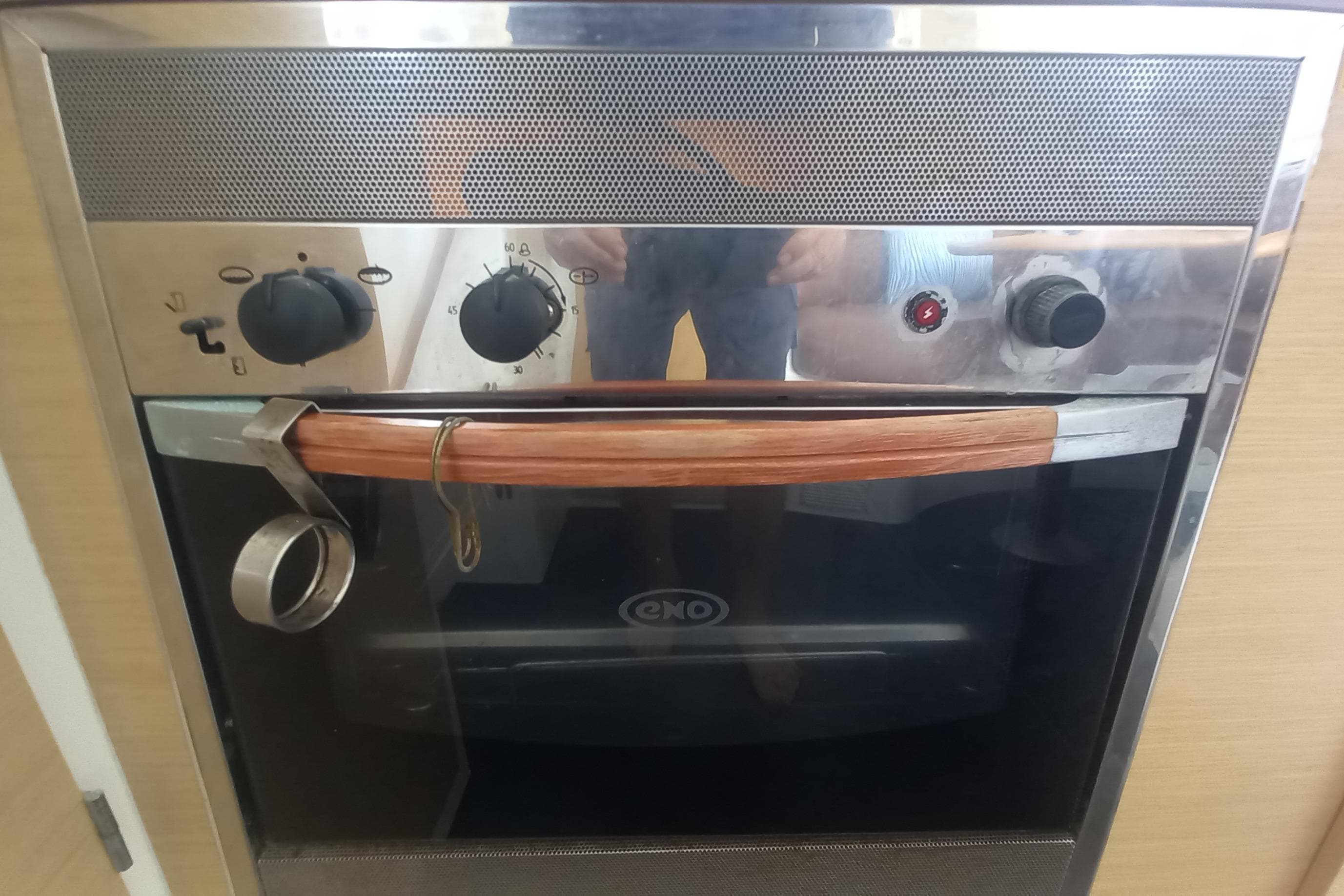Built-in oven with wooden handle on Lagoon 380 S2, 2008 model yacht.