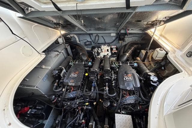 Engine compartment of a 2004 Sea Ray Sundancer 320, showcasing dual engines and mechanical components.