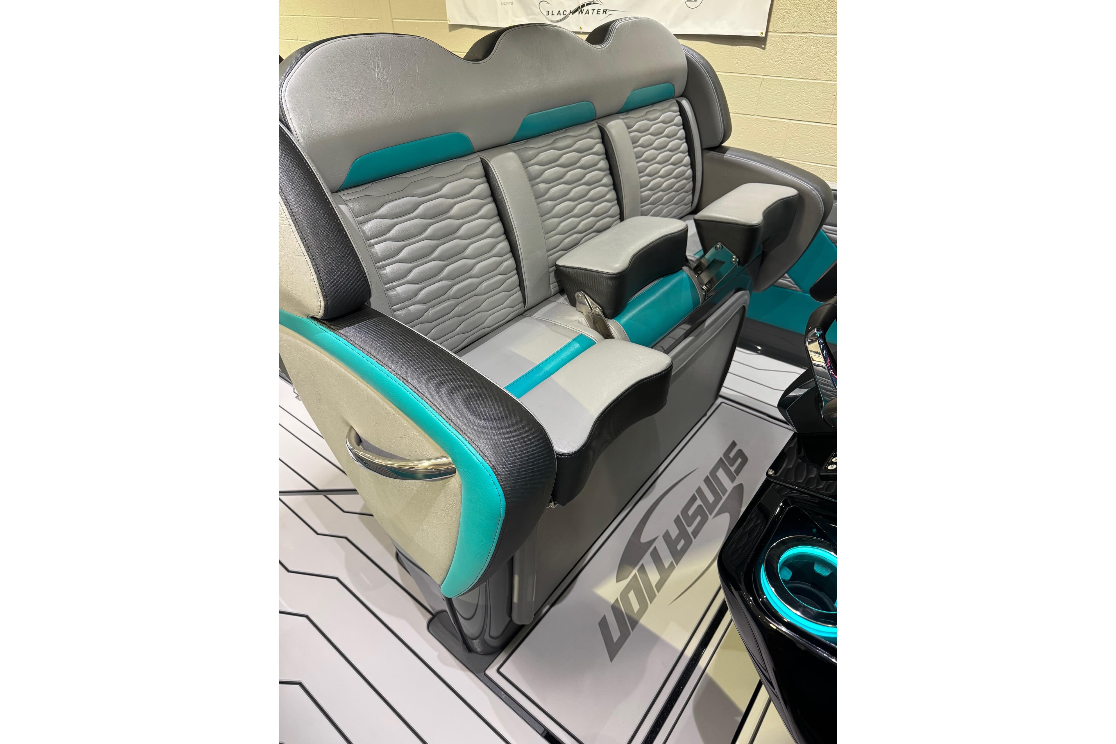 2026 Sunsation 34 CCX boat interior with stylish gray and teal seating.