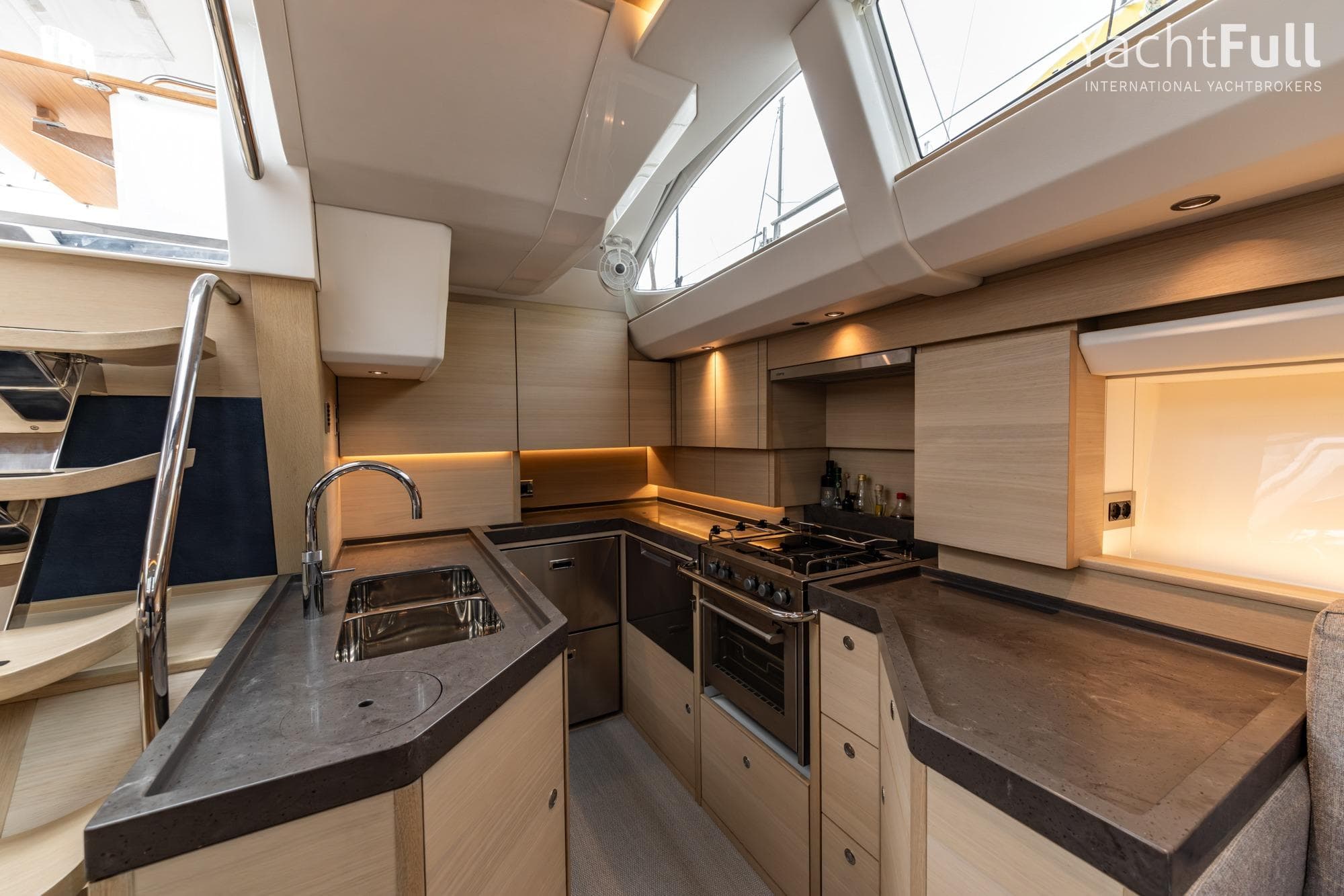 Luxurious 2024 Oyster 495 yacht kitchen with modern design and sleek countertops.