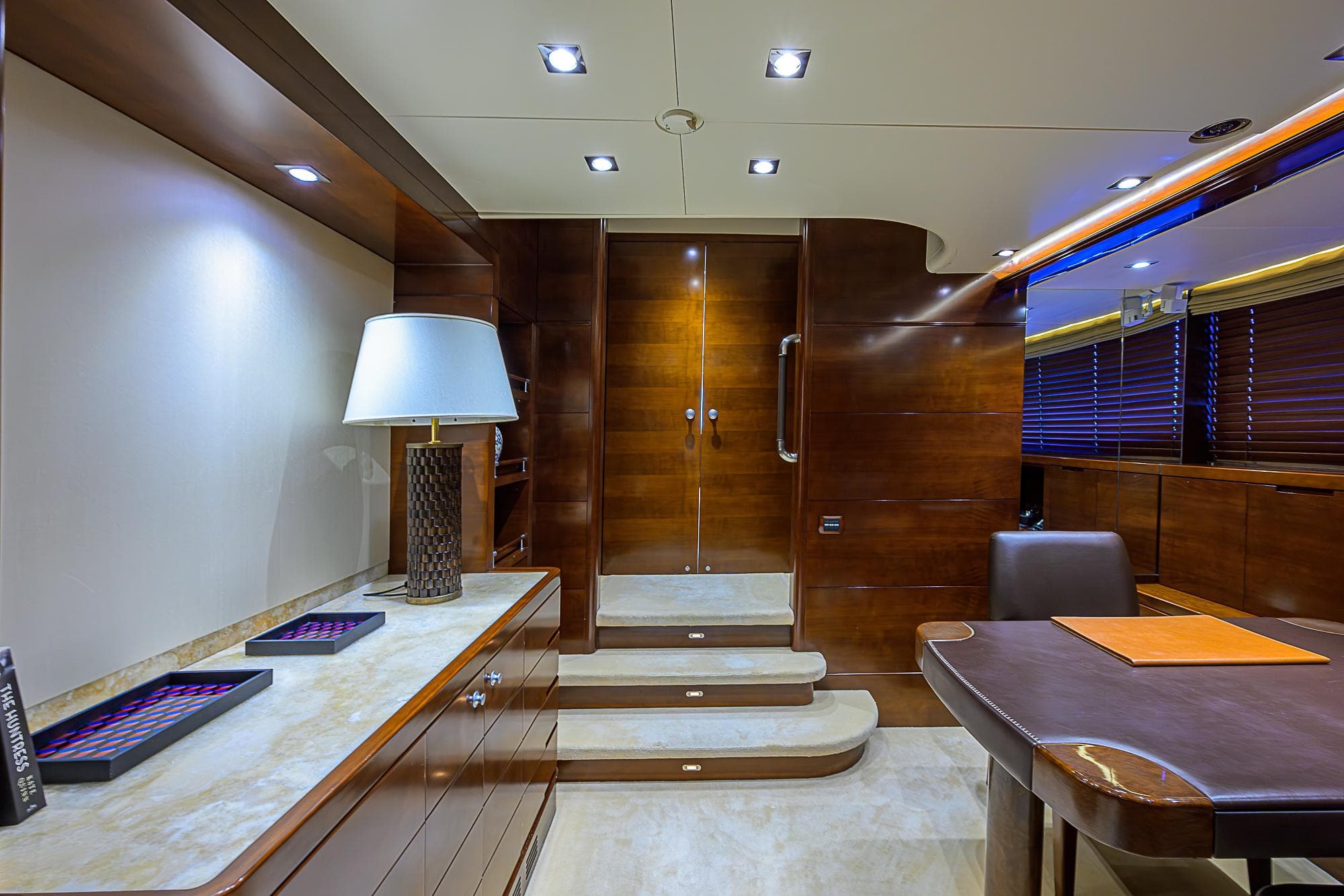 Luxurious interior of 2005 Benetti Vision 145 yacht with elegant wood finishes and modern lighting.