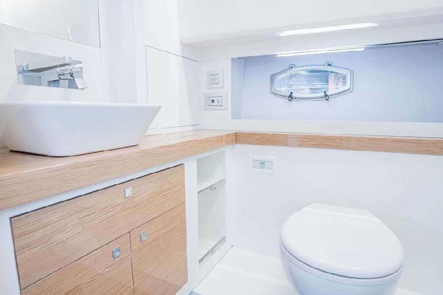 Luxurious bathroom in 2024 Rio Yachts Daytona 50, featuring modern fixtures and elegant design.