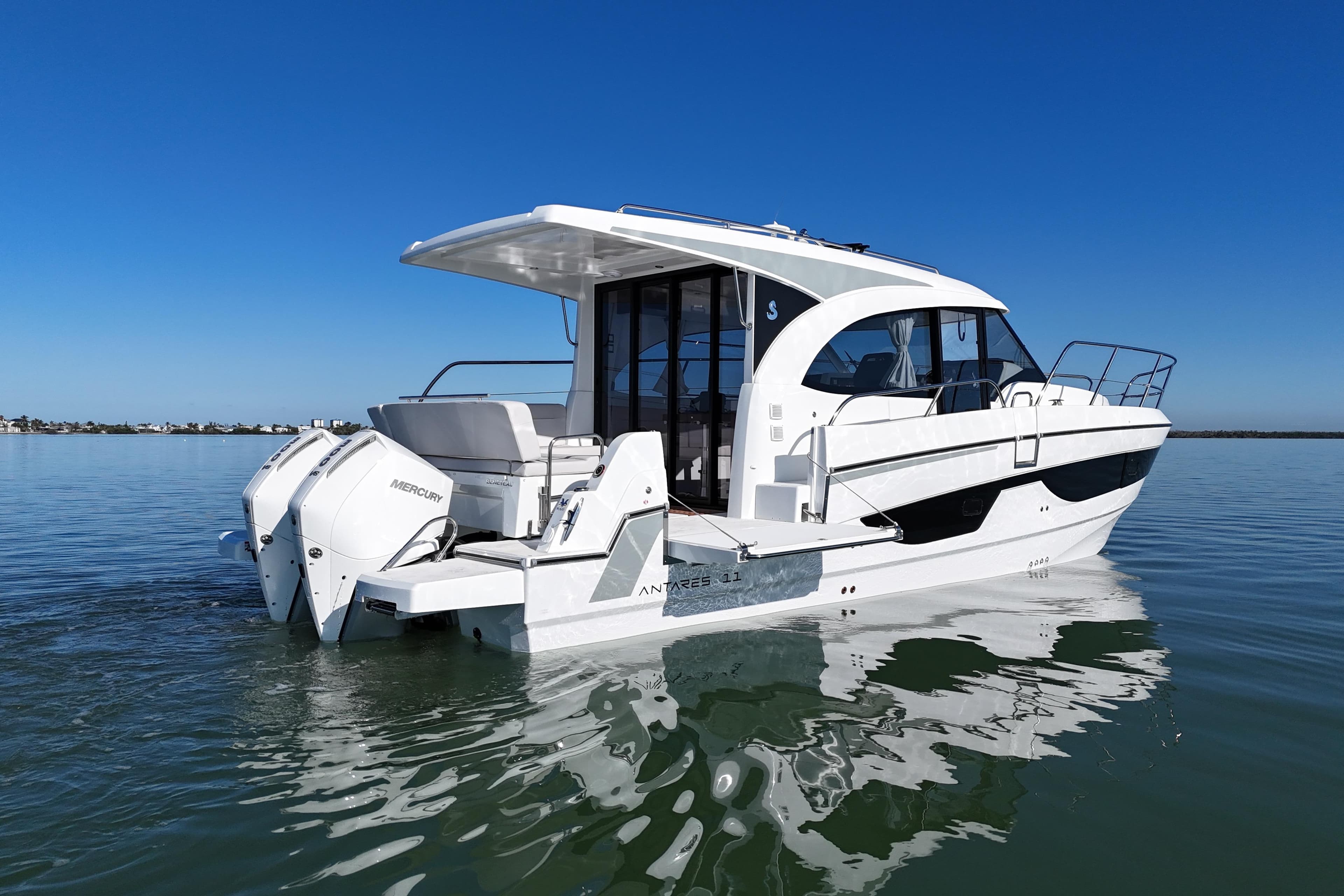 2026 Beneteau Antares 11 boat on calm water, featuring twin Mercury engines.