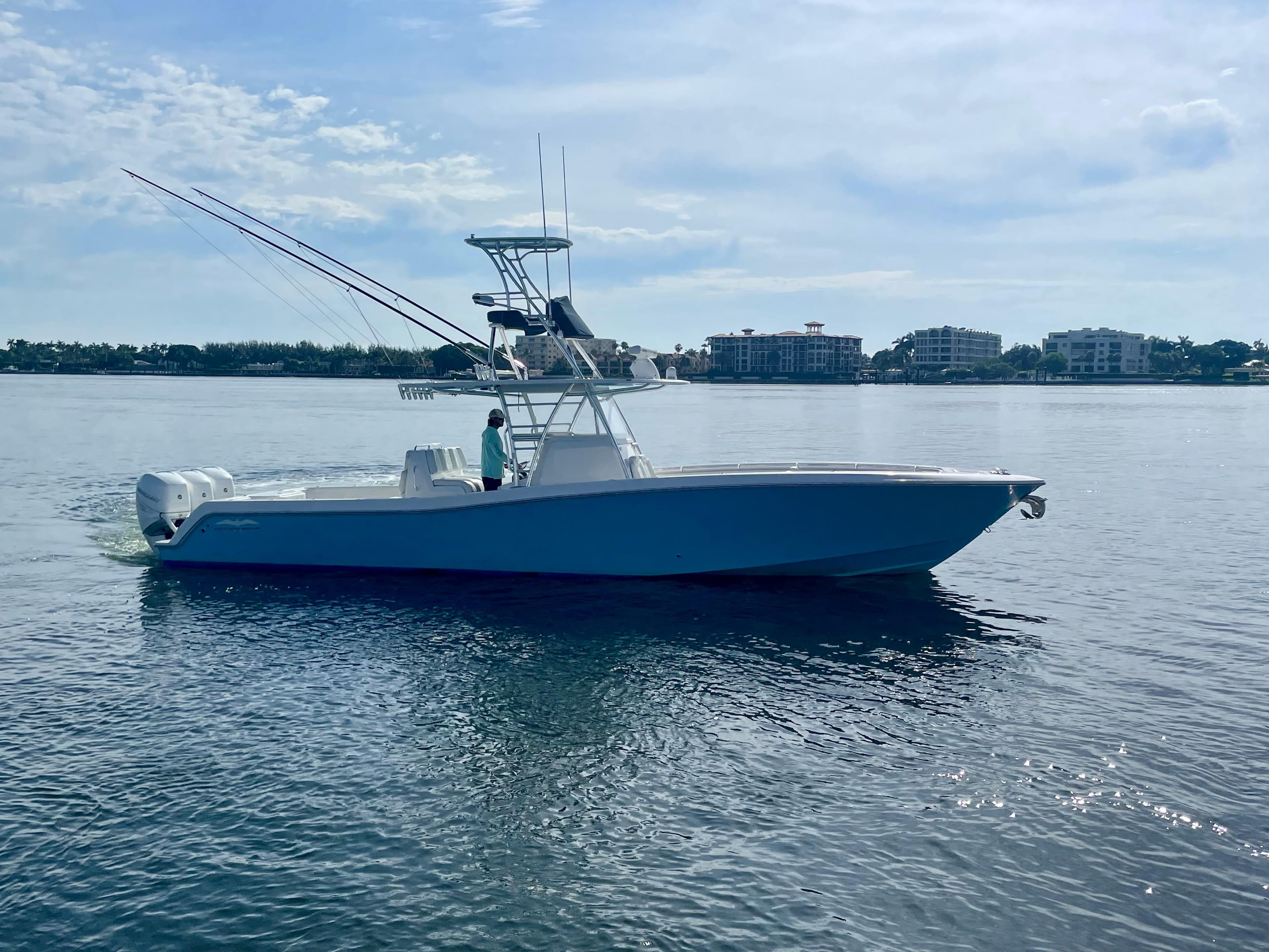 2019 Invincible 39 Open Fisherman boat on calm water.