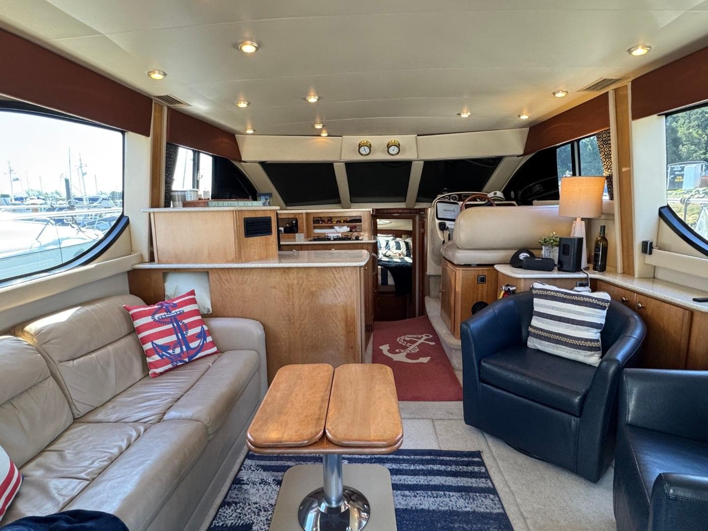 Luxurious interior of a 2003 Meridian 381 Sedan yacht with elegant seating and decor.