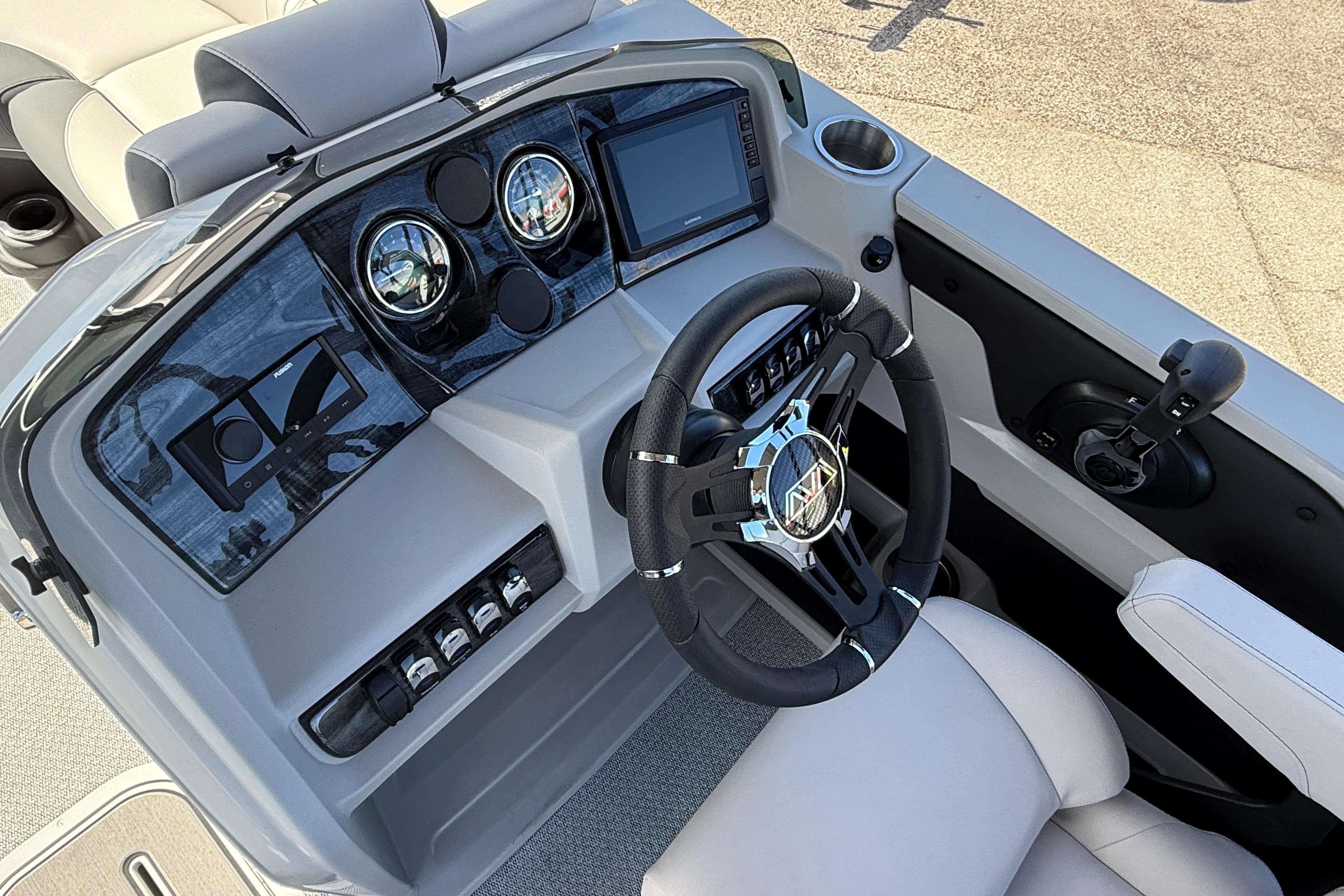 2026 Avalon 2385 LSZ Quad Lounger dashboard with modern controls and steering wheel.