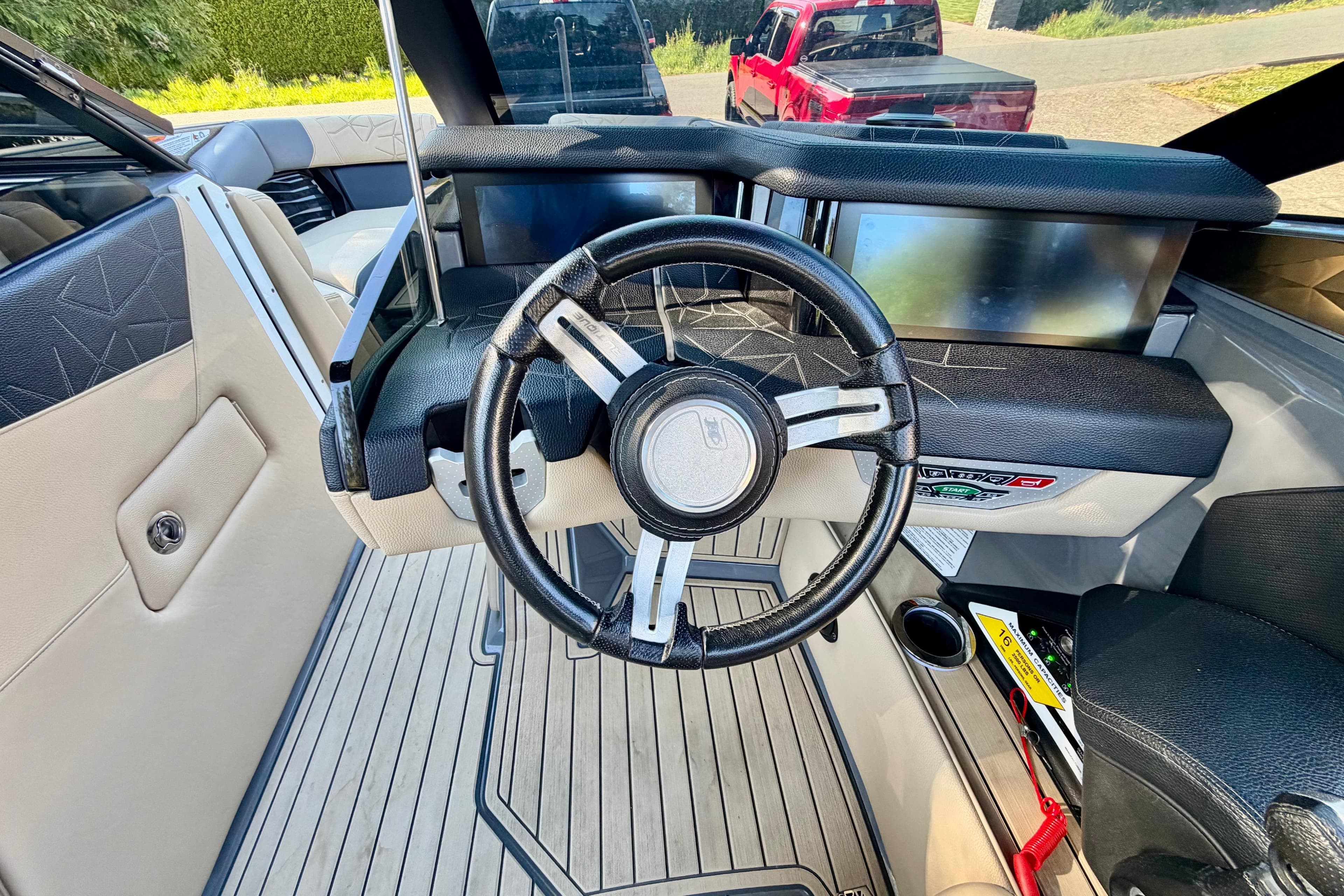 2020 Nautique Super Air Nautique G23 Paragon steering wheel and dashboard interior.