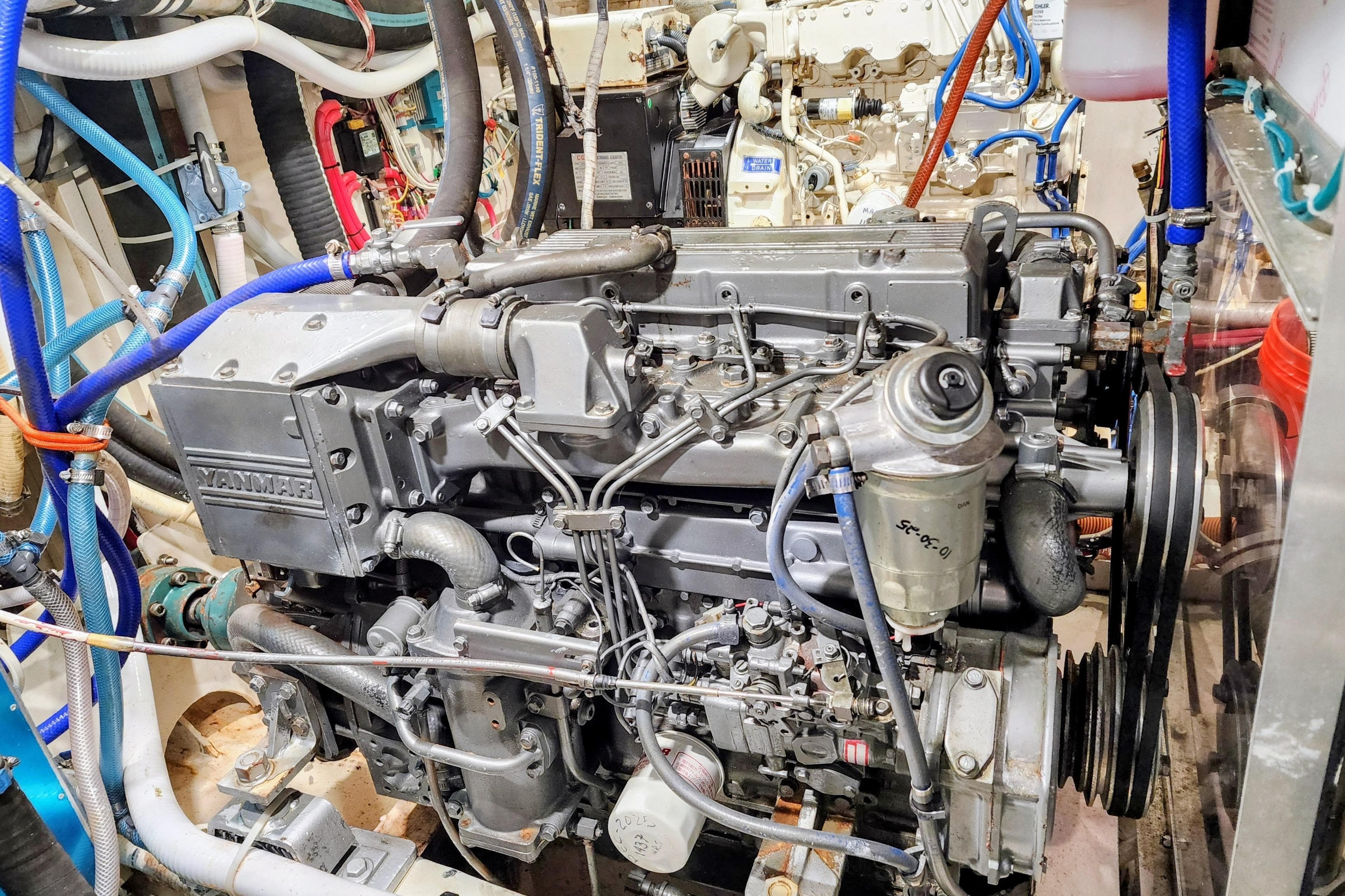 Engine room of a 1995 Benford Custom Pilothouse Cutter with Yanmar engine.