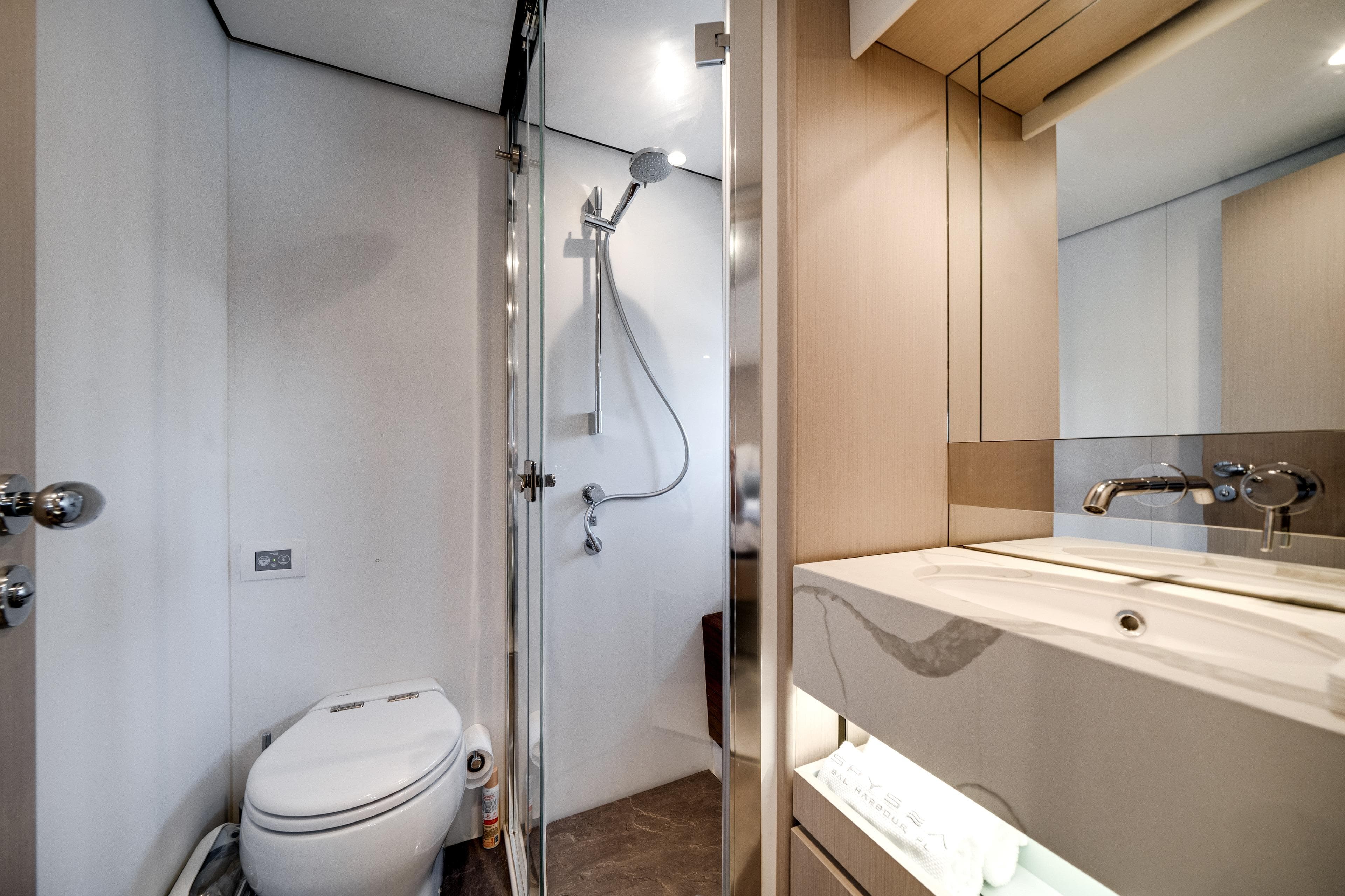 Luxurious bathroom in 2023 Azimut Fly 68 yacht with modern fixtures and elegant design.