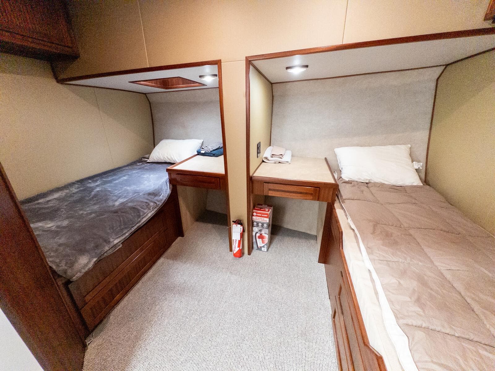 Two cozy single beds in a 1986 Custom Expedition Vessel 58 cabin.