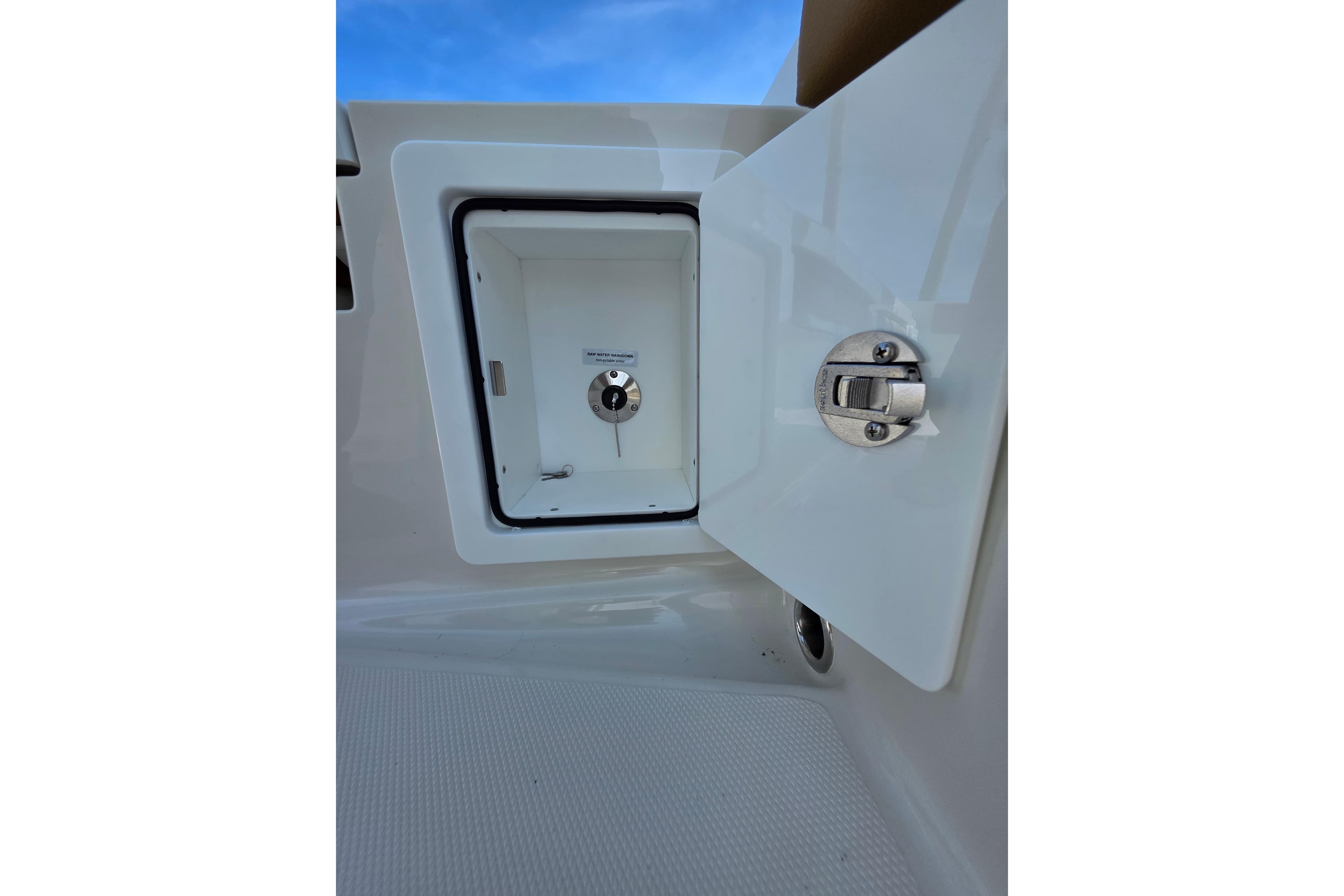 Open storage compartment on 2026 Ranger 2660 Bay boat, featuring secure latch mechanism.